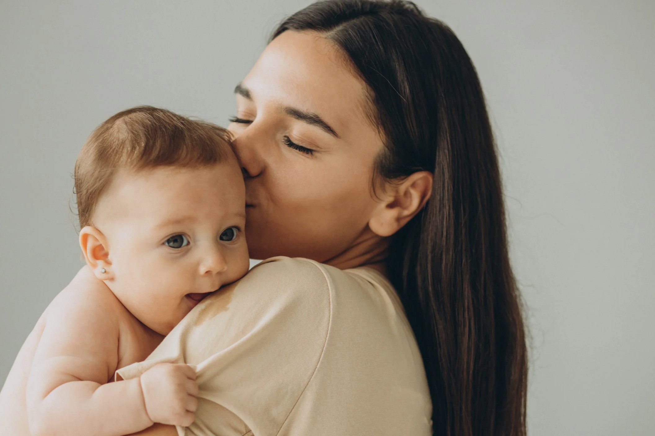 A mother and baby calm and regulated after a session focused on infant nervous system support and cranial tension release in Spokane.