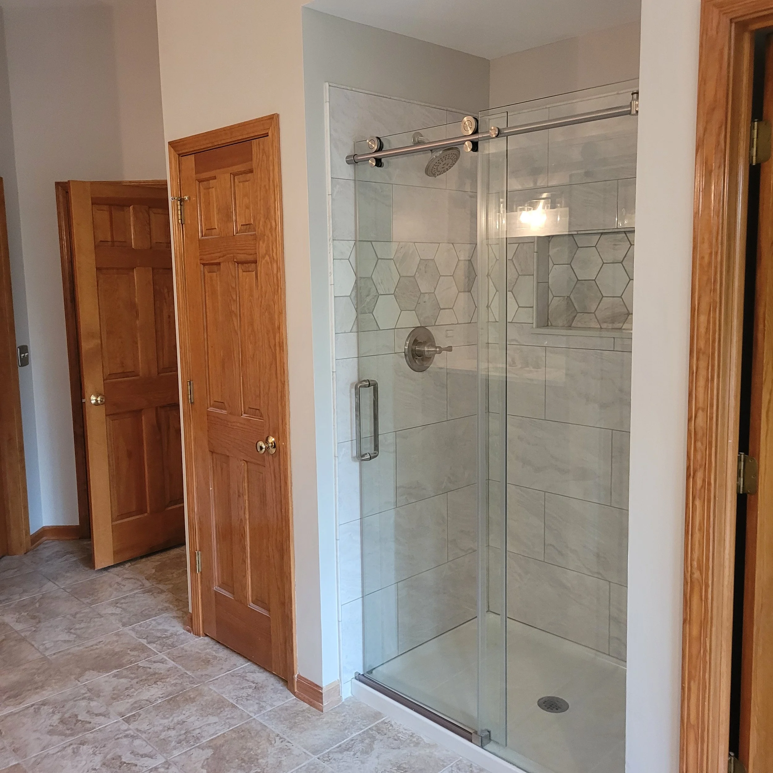 finished bathroom remodel with new king suite shower, new tiles, fixtures, flooring, shower bench