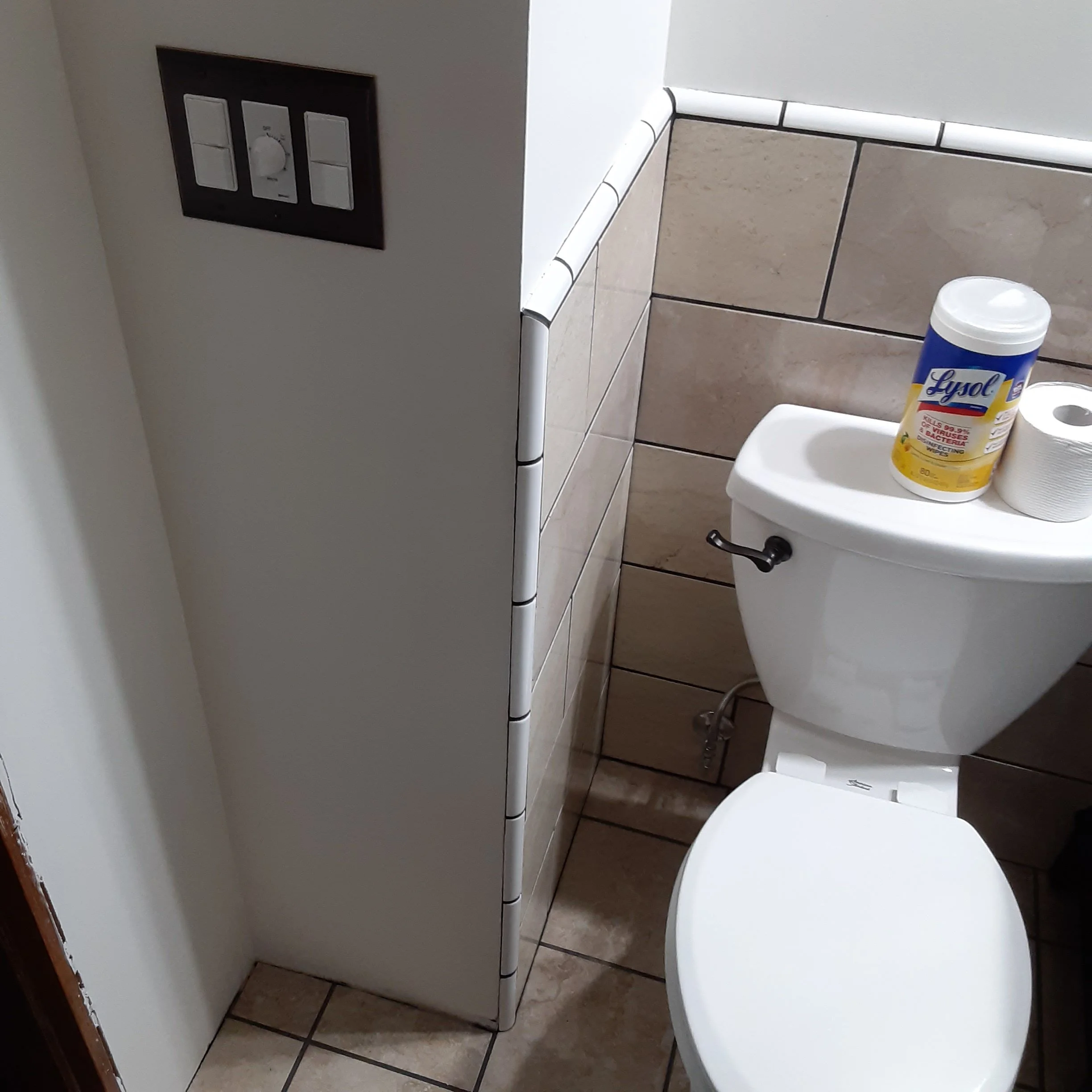 new bathroom remodel with toilet, and towel and tp hardware and new light switch, 4 switch dimable