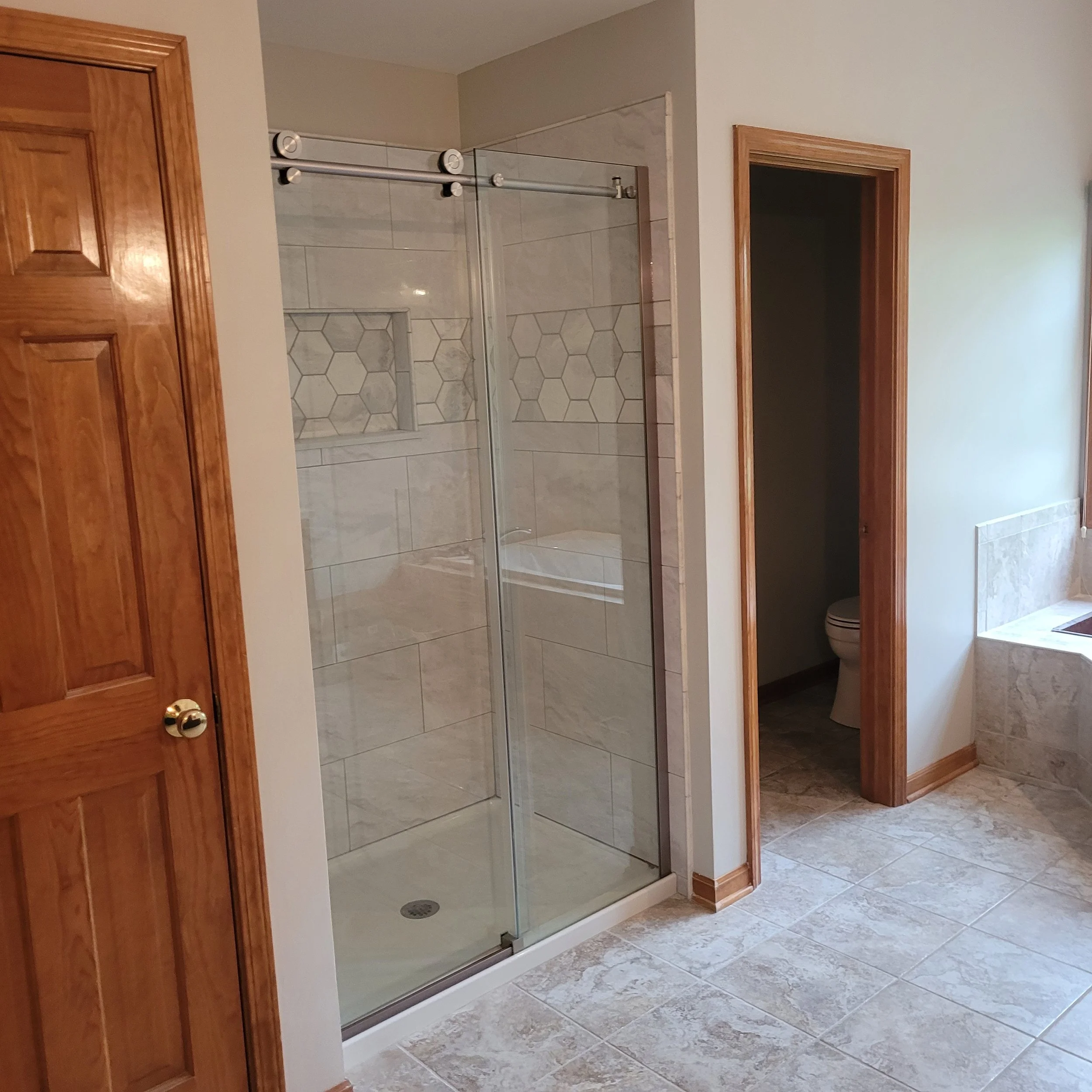 finished remodel with new king suite shower, new tiles, fixtures, flooring, shower bench