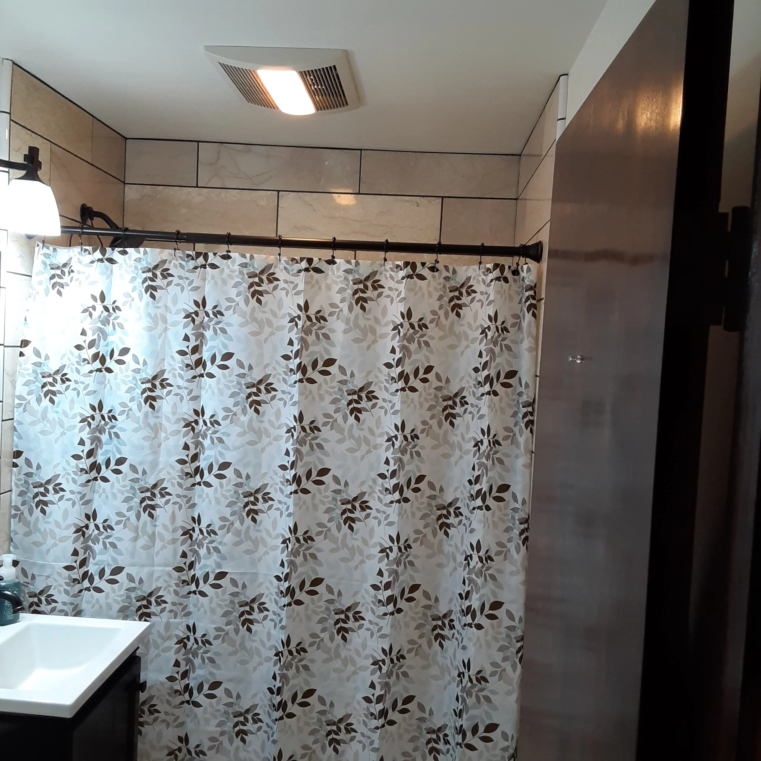 Finished bathroom remodel with new tile, new sink, new tub, new flooring. expertly handcrafted. 