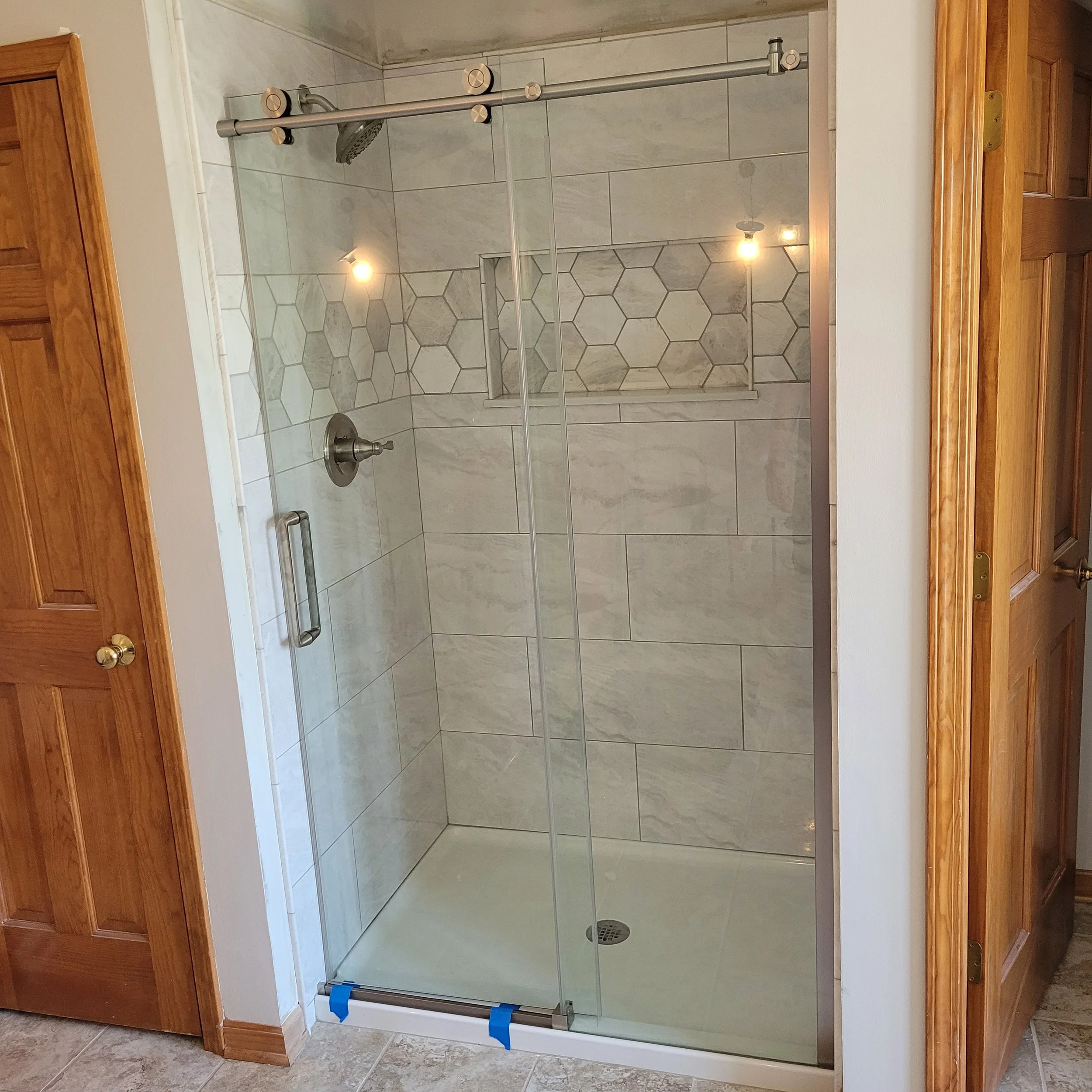 finished remodel with new king suite shower, new tiles, fixtures, flooring, shower bench