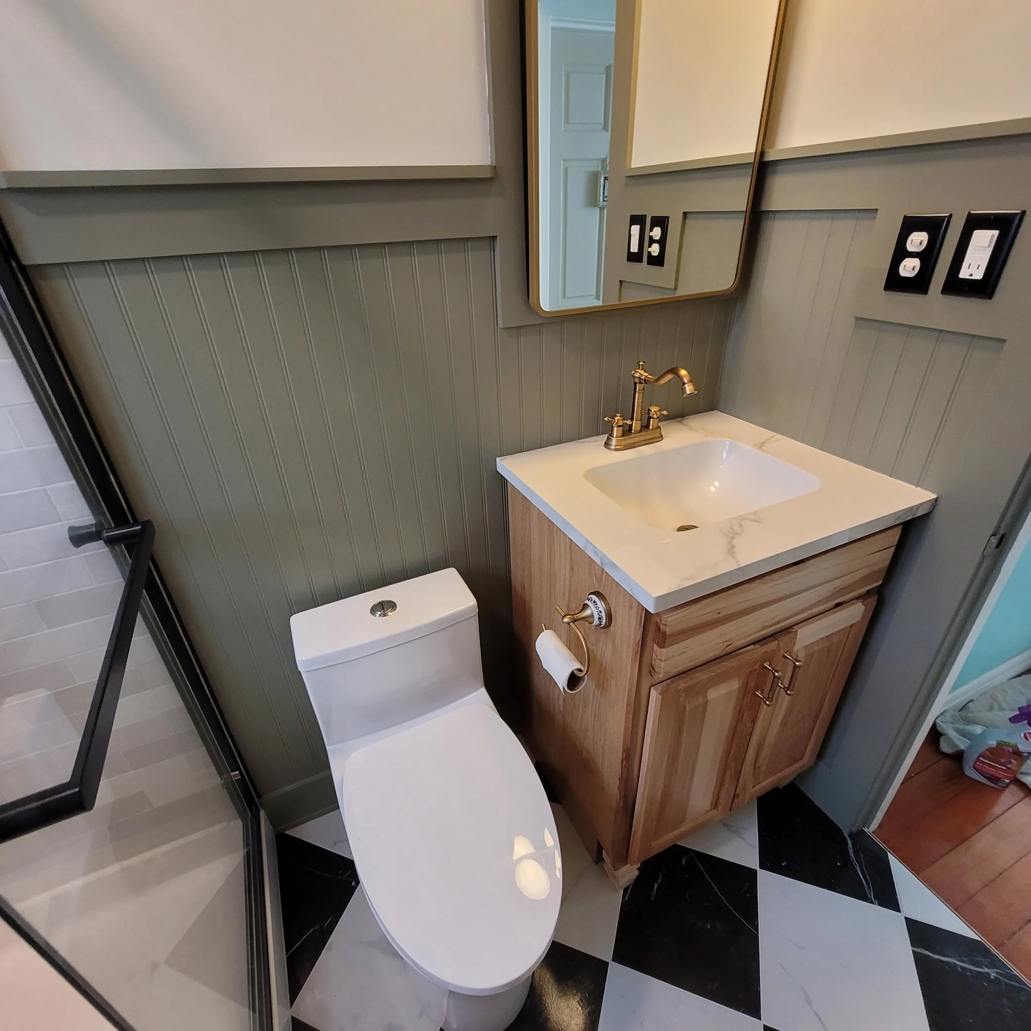 Finished bathroom remodel with checkered flooring, wood ceiling and beam, updated shower and vanity, new eco-toilet,  with a farm house feel.