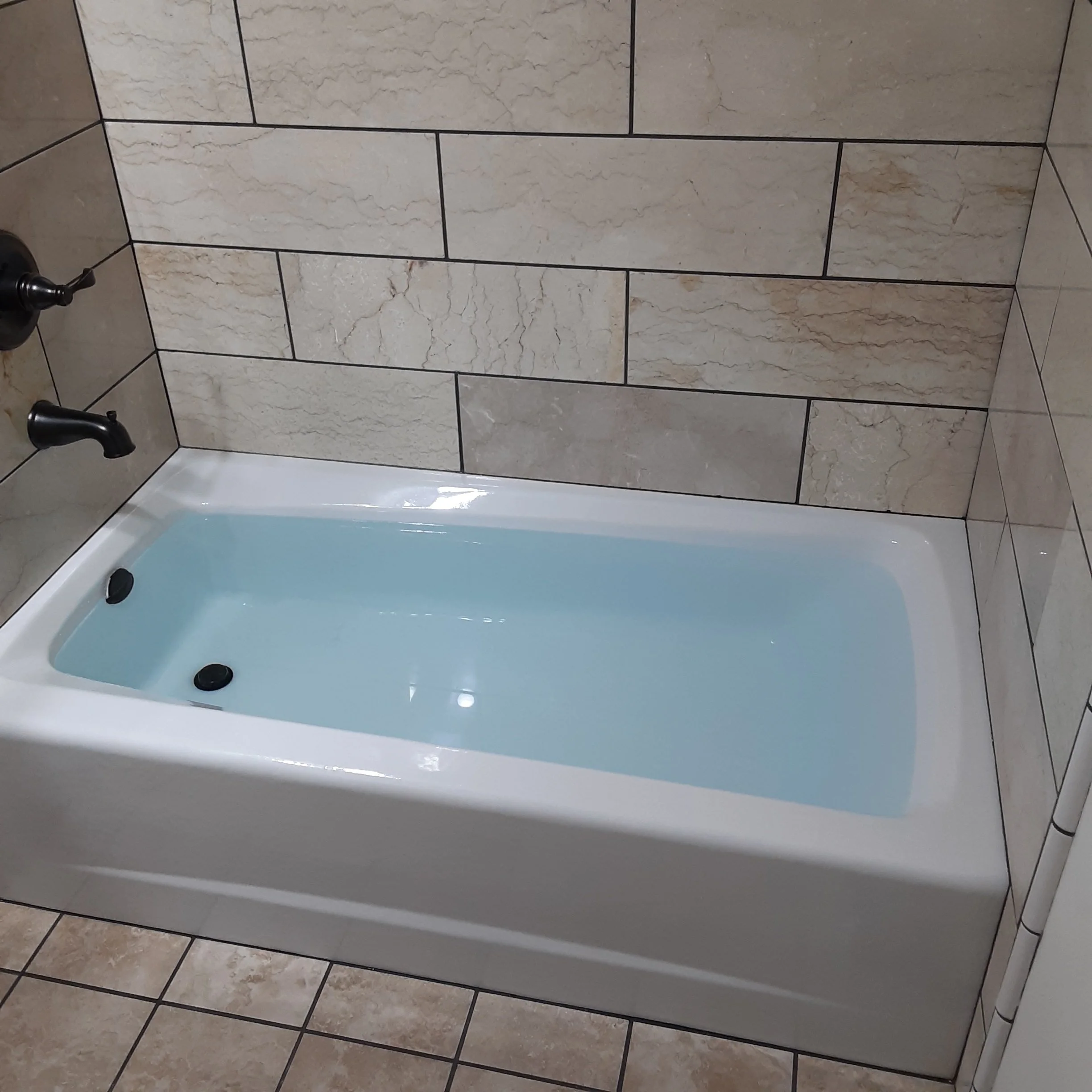 new bath tub in finish remodel with beautiful tile work
