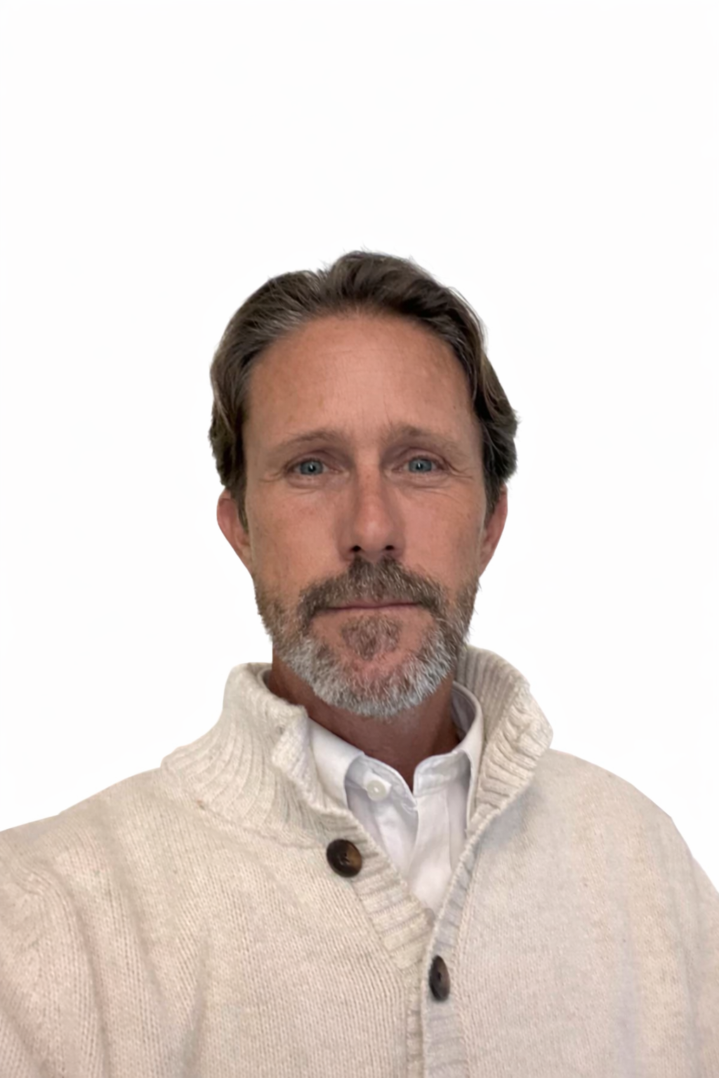 Portrait of a middle-aged man with brown hair, blue eyes, and a beard, wearing a beige knit sweater over a white collared shirt, against a plain white background.