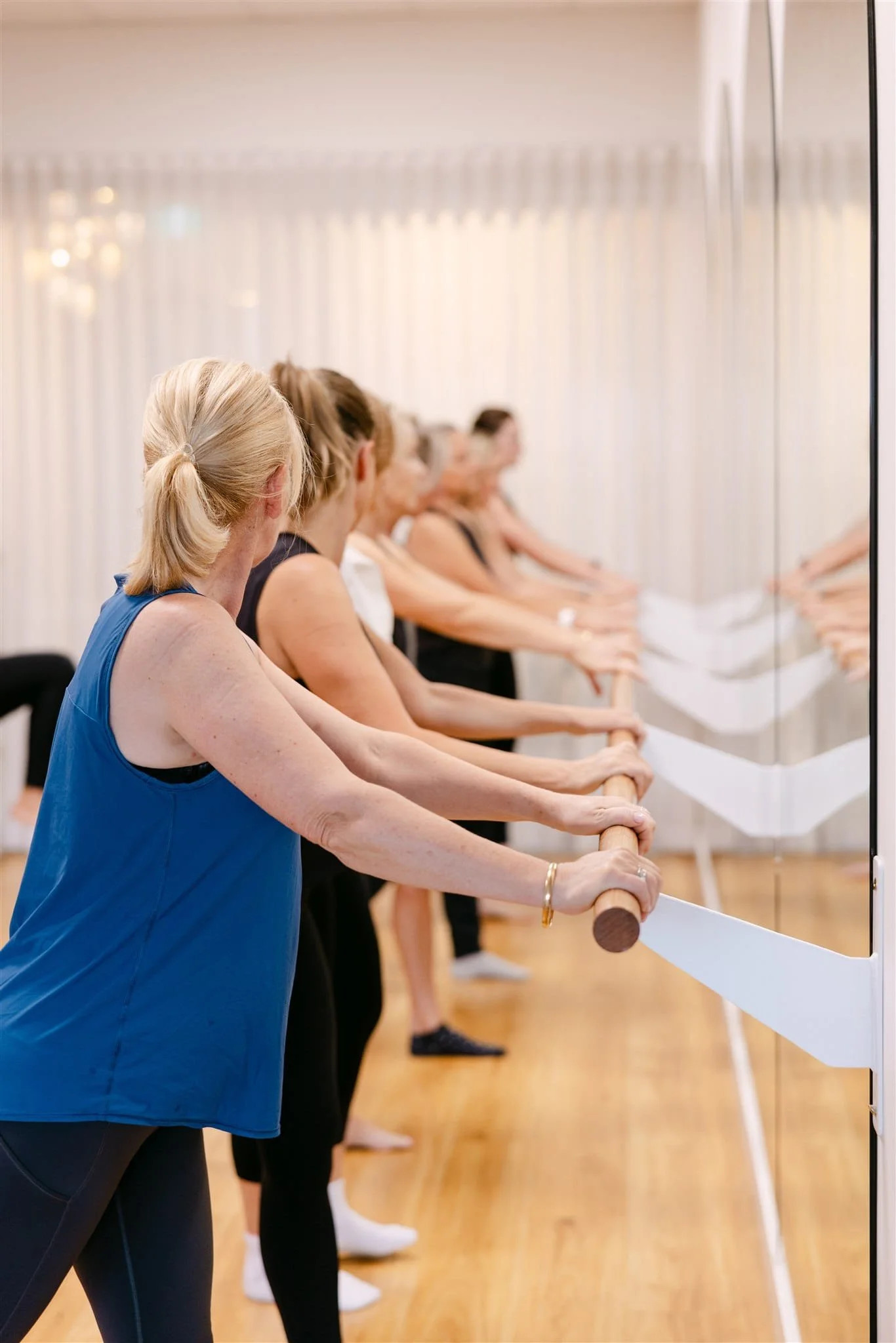 women in a Barre class