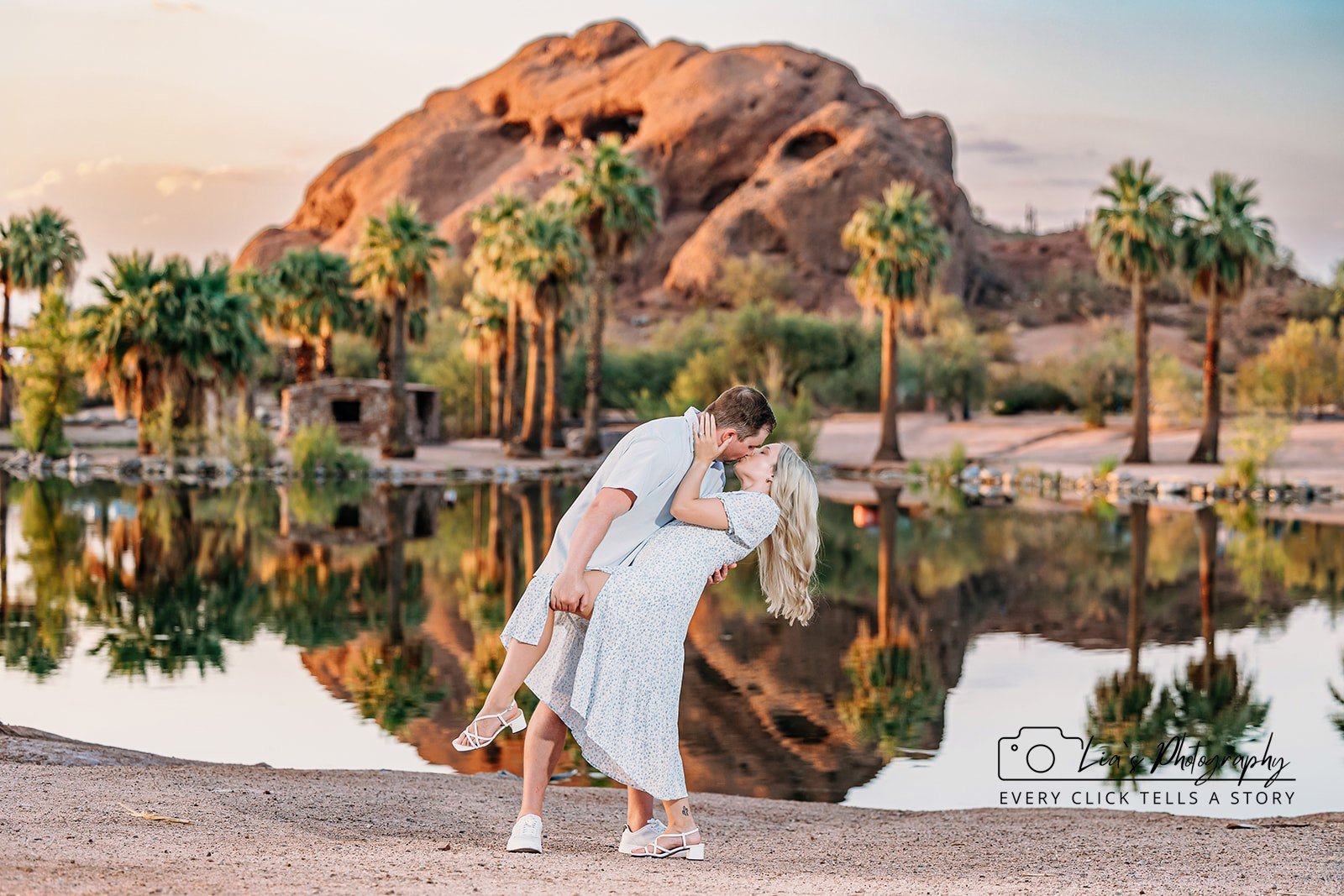 Romantic sunset engagement session in Scottsdale, Arizona featuring a couple embracing in the desert landscape. Captured by Lia’s Photography, specializing in elegant Phoenix engagement photography.