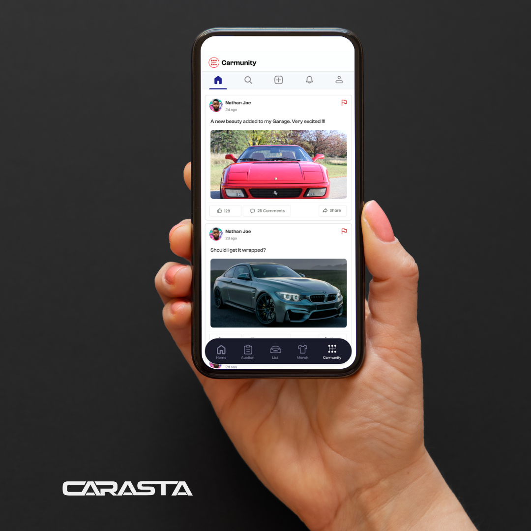 Hand holding a smartphone displaying a social media app named 'Carmunity' with posts about cars, including a red Ferrari and a gray BMW.