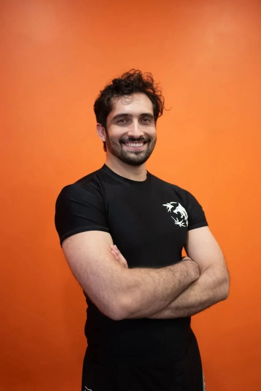 Head coach of Brooklyn Heights Jiu Jitsu gym smiling to the camera.
