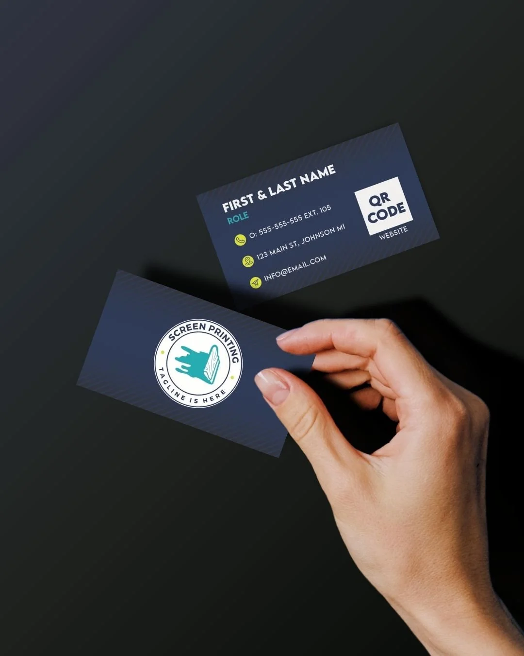Hand holding a business card with a screen printing logo and a second card displaying contact information and a QR code.