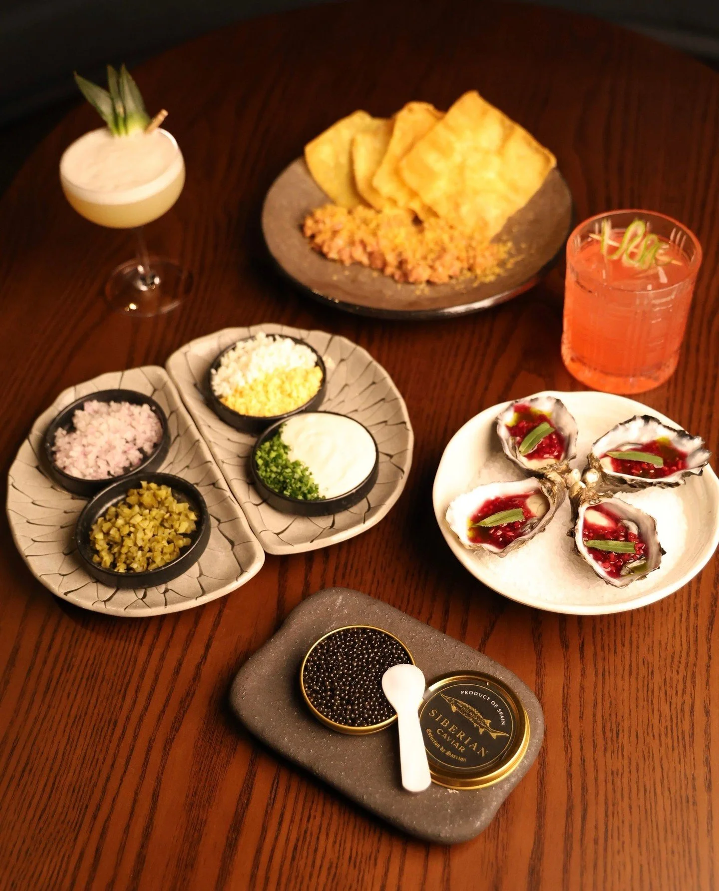 The best stories start with snacks and a smouldering cocktail,  our snack menu is designed for the ultimate social ritual. 

Ft. 
20g Baeri Sturgeon Caviar and Rock Oyster, Blackberry Mignonette, Tarragon.