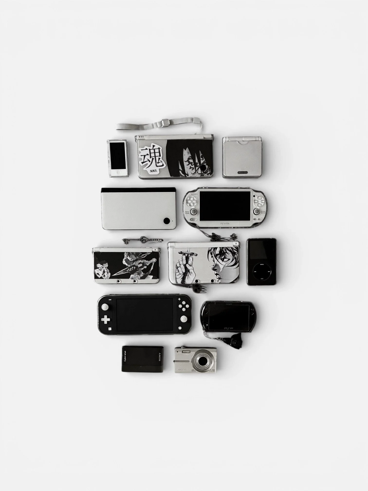 Collection of various electronic devices and accessories arranged on a white background, including a digital camera, gaming consoles, MP3 players, and small cases.