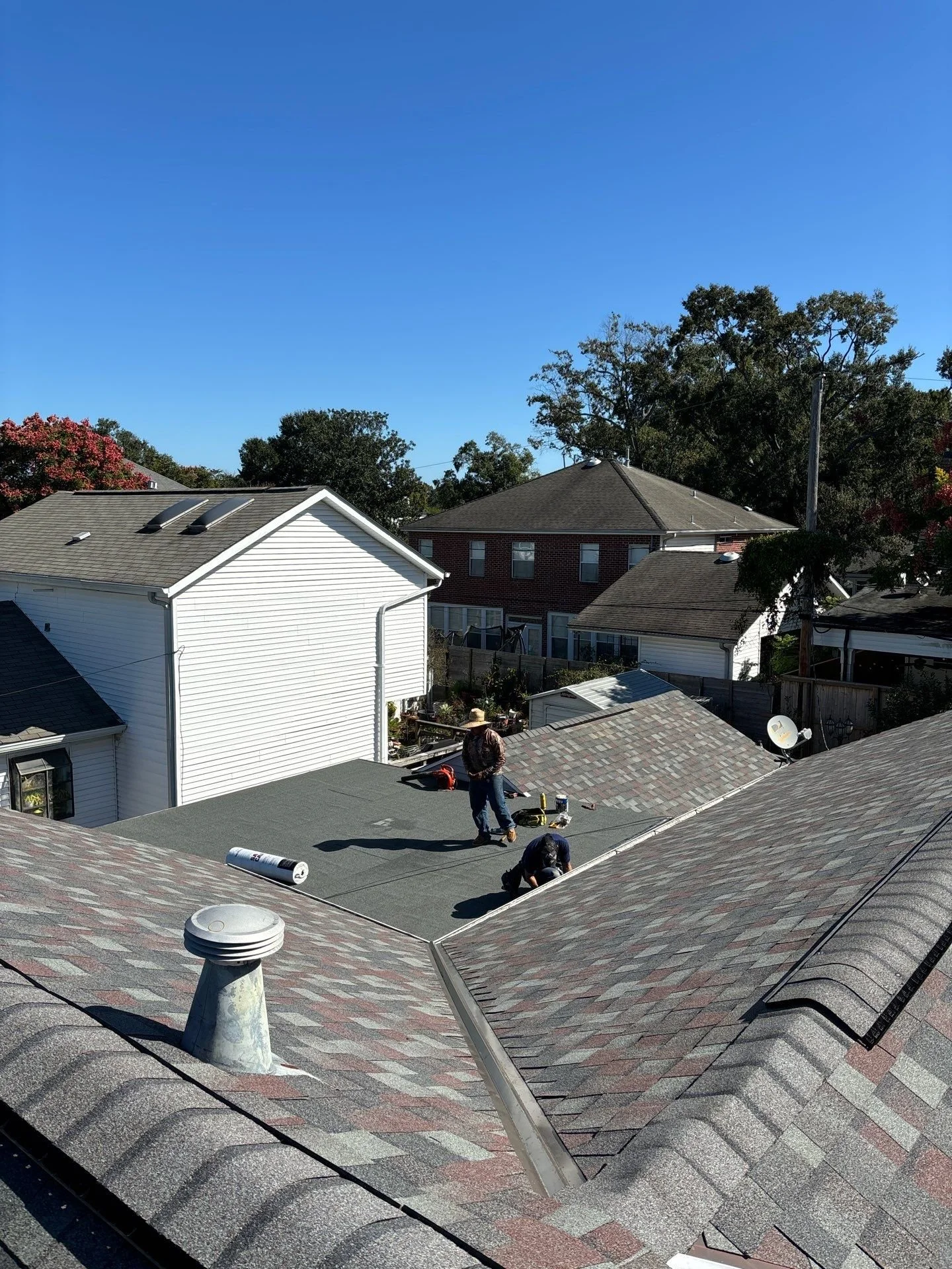Highpoint Roofing & Construction crew replacing a residential roof in Mississippi — professional shingle installation with quality workmanship