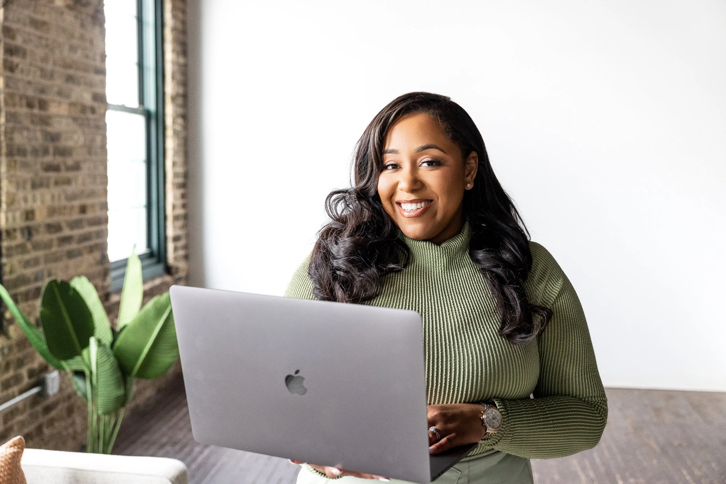 Marketer creating branding on laptop