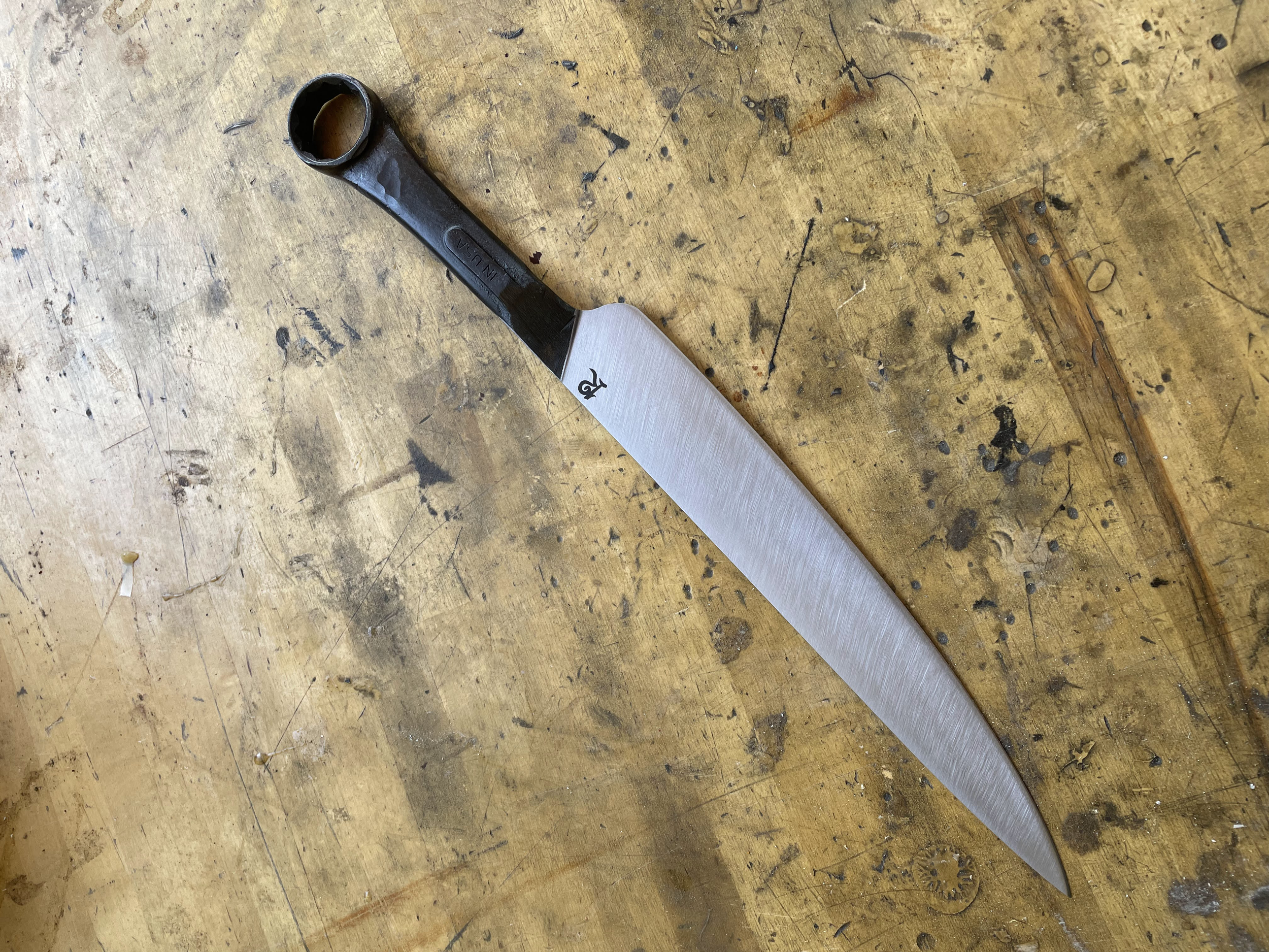 This was a very special project for a friend of a friend: a retired mechanic who lost his house in one of our California wildfires. I made a BBQ slicer from a wrench that was recovered from the debris (2021)