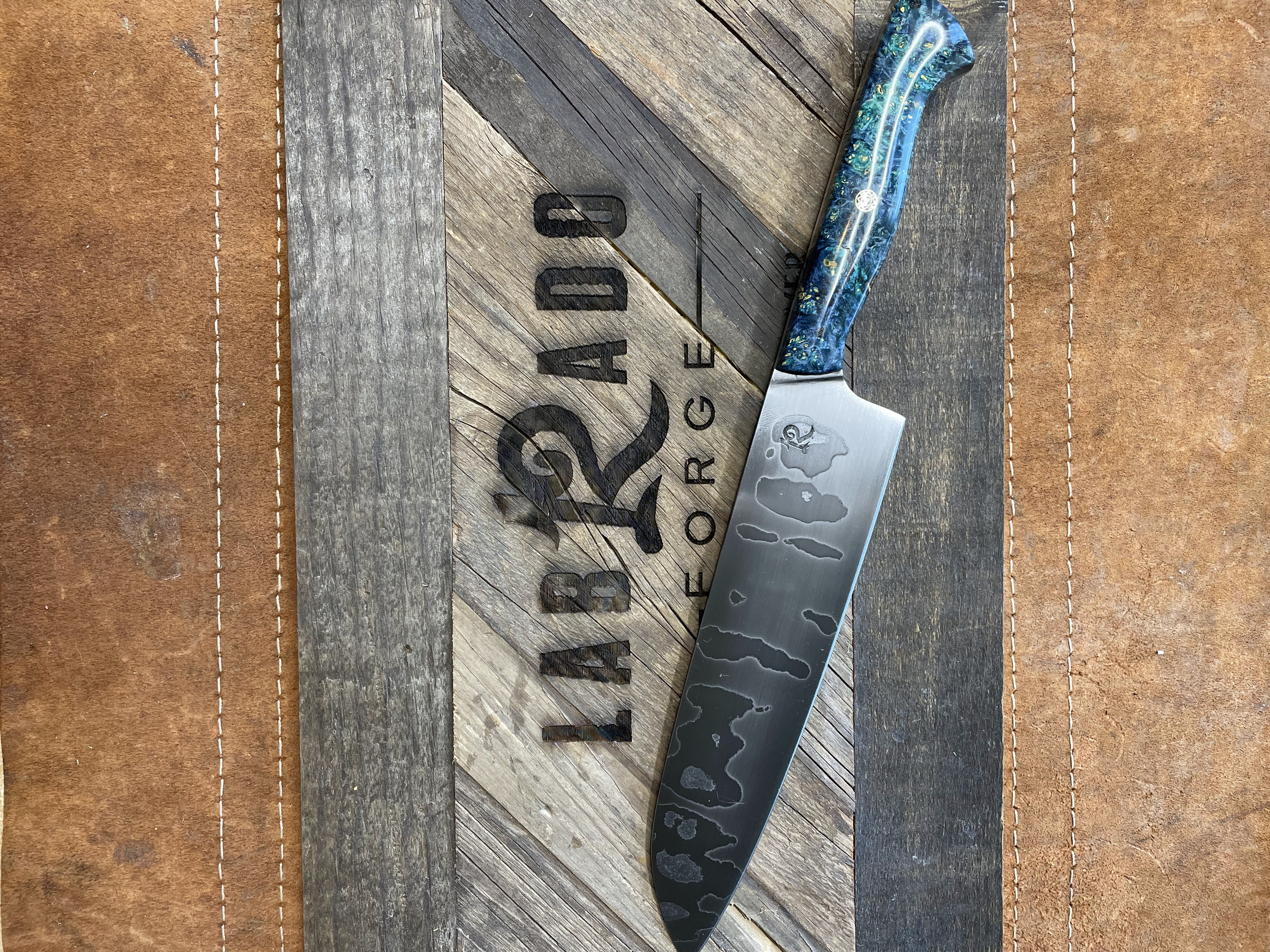Custom order santoku. Random pattern sanmai with dyed and stabilized maple burl handle (2023)