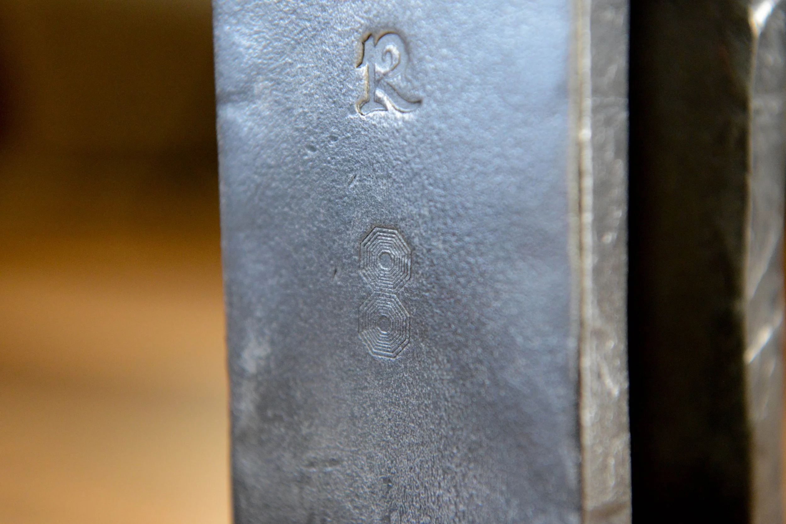 Labrado Forge touchmark on blacksmithing project, a custom dining table