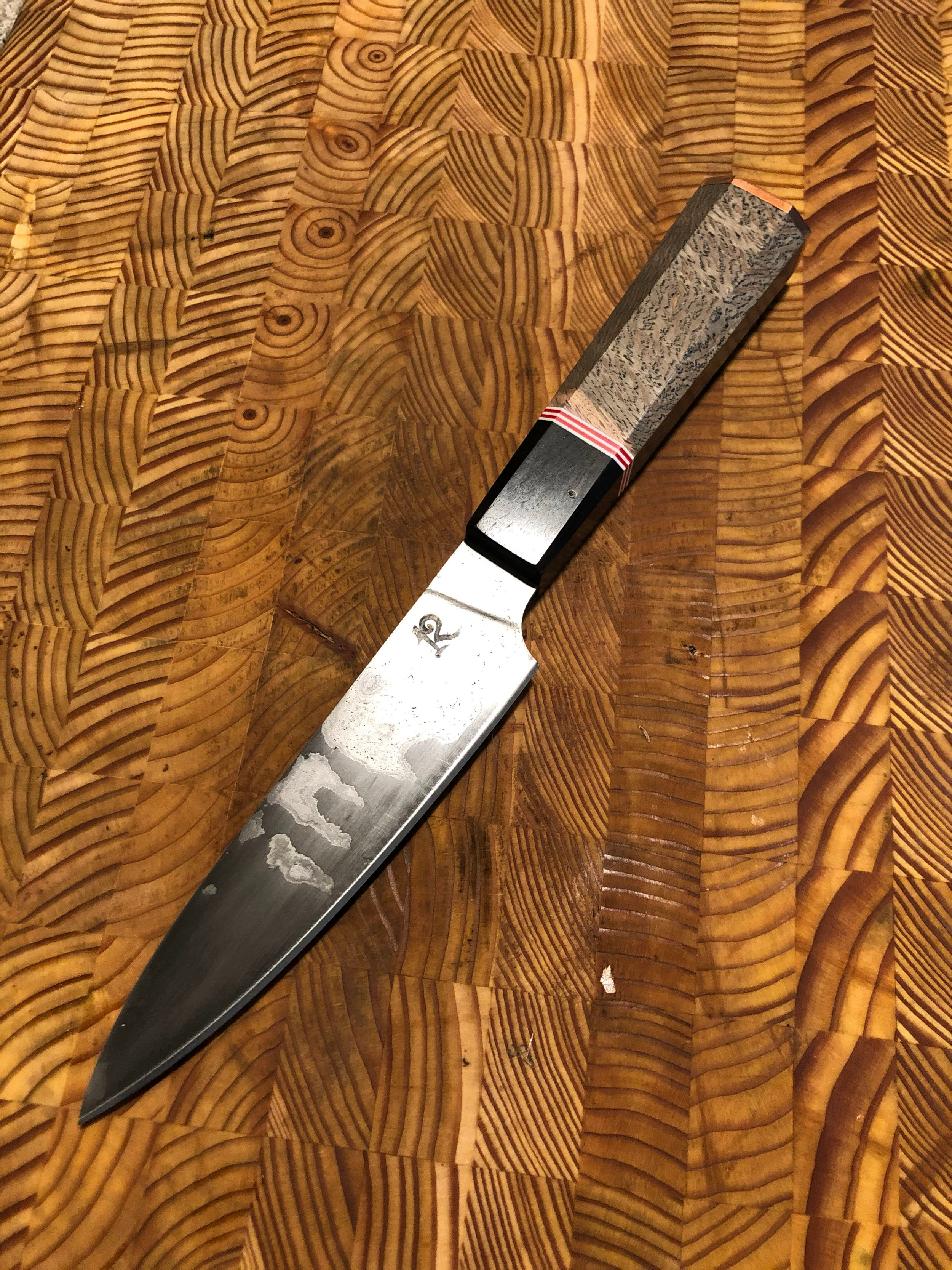 A very special Petty for a dear friend. Wrought iron sanmai blade. Oak and blackwood handle with red and white spacers and copper endcap (2020)