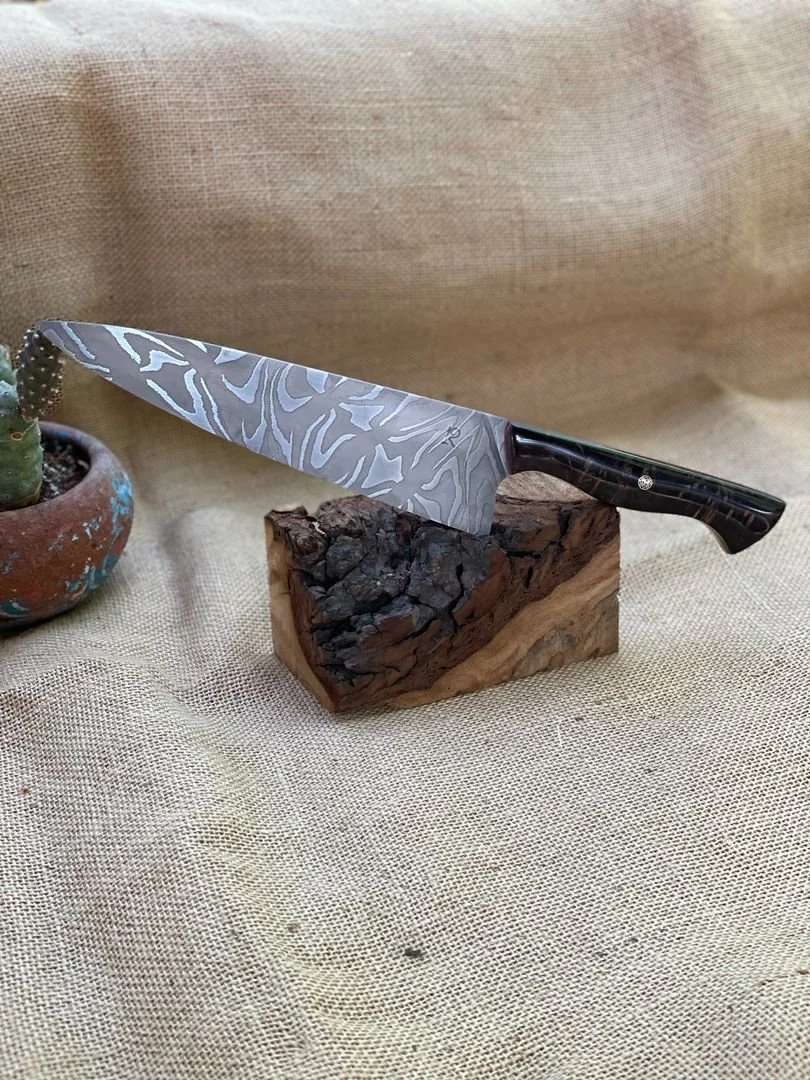 8” chef of low-layer count damascus- 1095 and 15n20. Low contrast finish. Handle is dyed maple burl (2022)