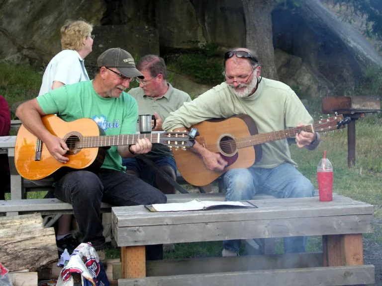 Some Squalicum Yacht Club members play guitar at a club cruise.