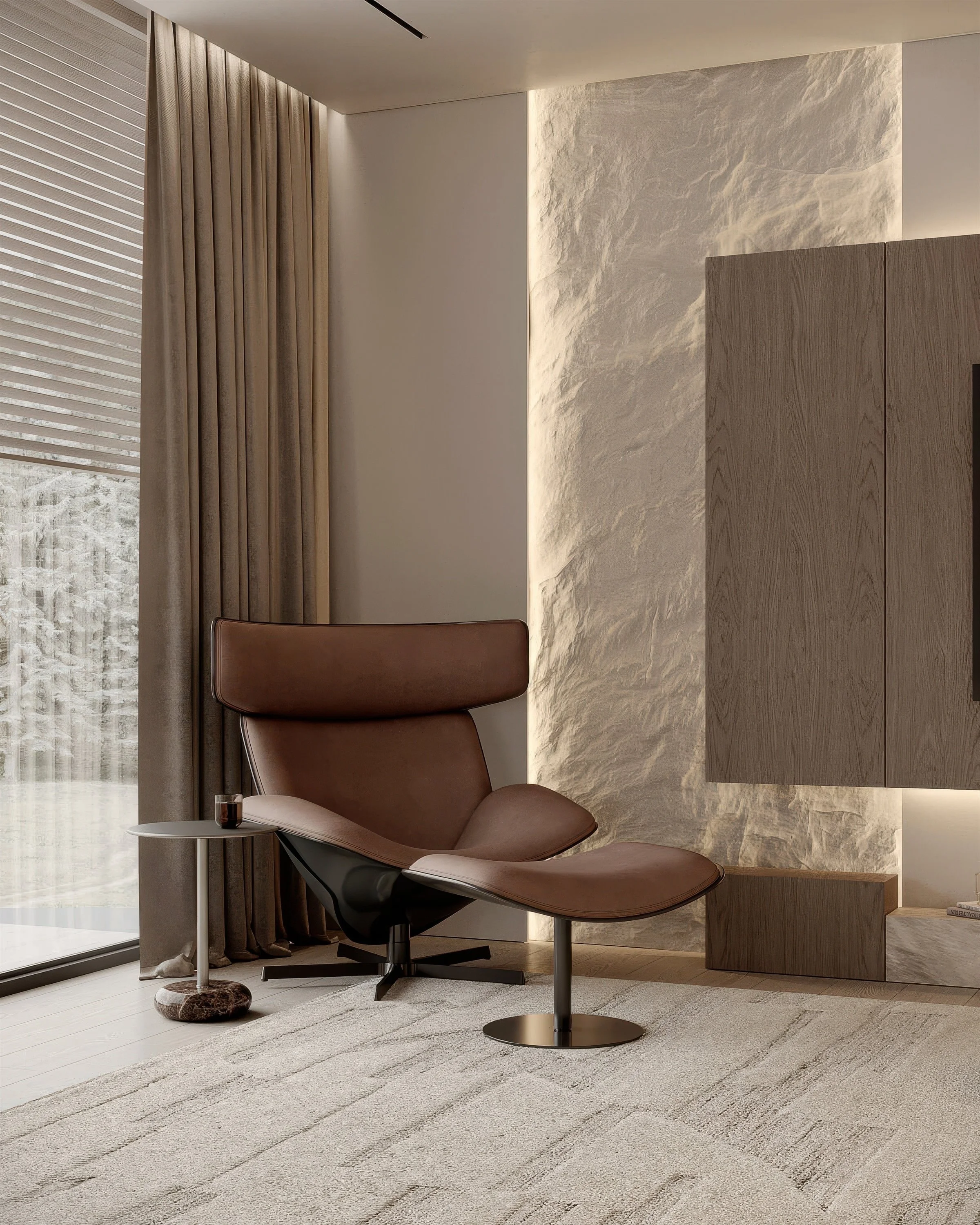 Modern corner of a room with a brown leather lounge chair and matching ottoman, a side table with a glass of wooden base, beige curtains, and textured beige wall with built-in wooden cabinet.