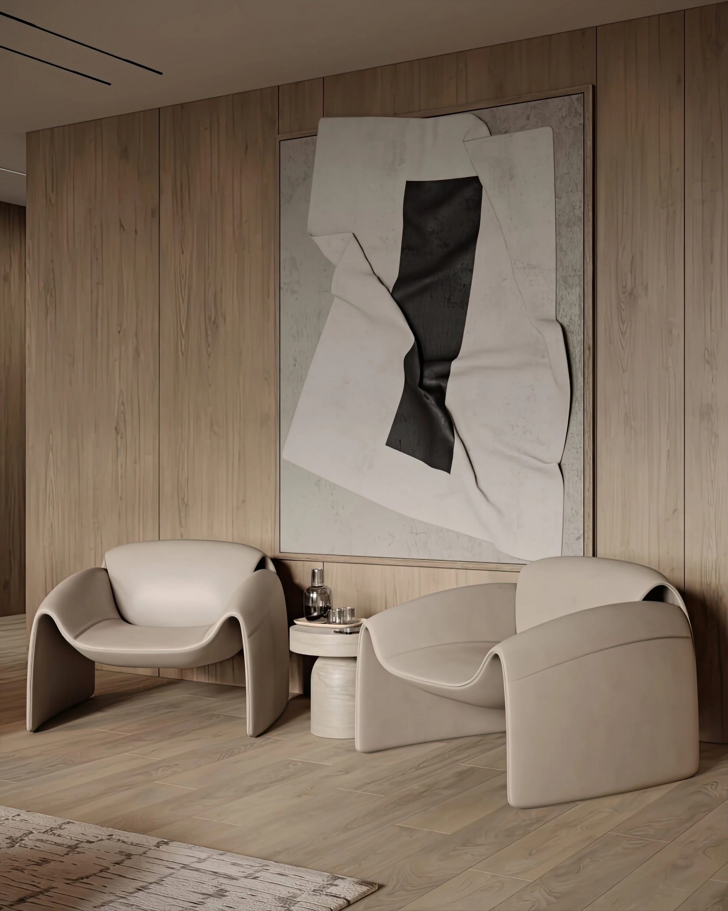 Modern waiting area with two beige armchairs and a small round side table with a decanter and glasses, large abstract black and white artwork on wood-paneled wall.