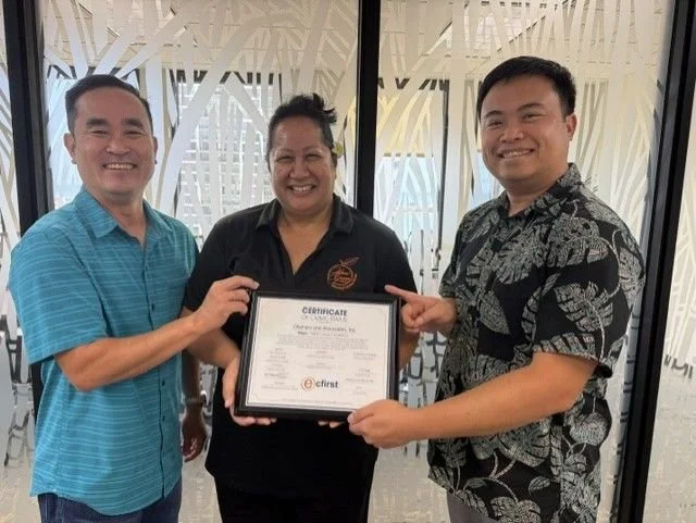 Adrienne Chee of Alani Group with Okahara and Associates, Inc. leaders holding their CMMC Level 2 certificate.