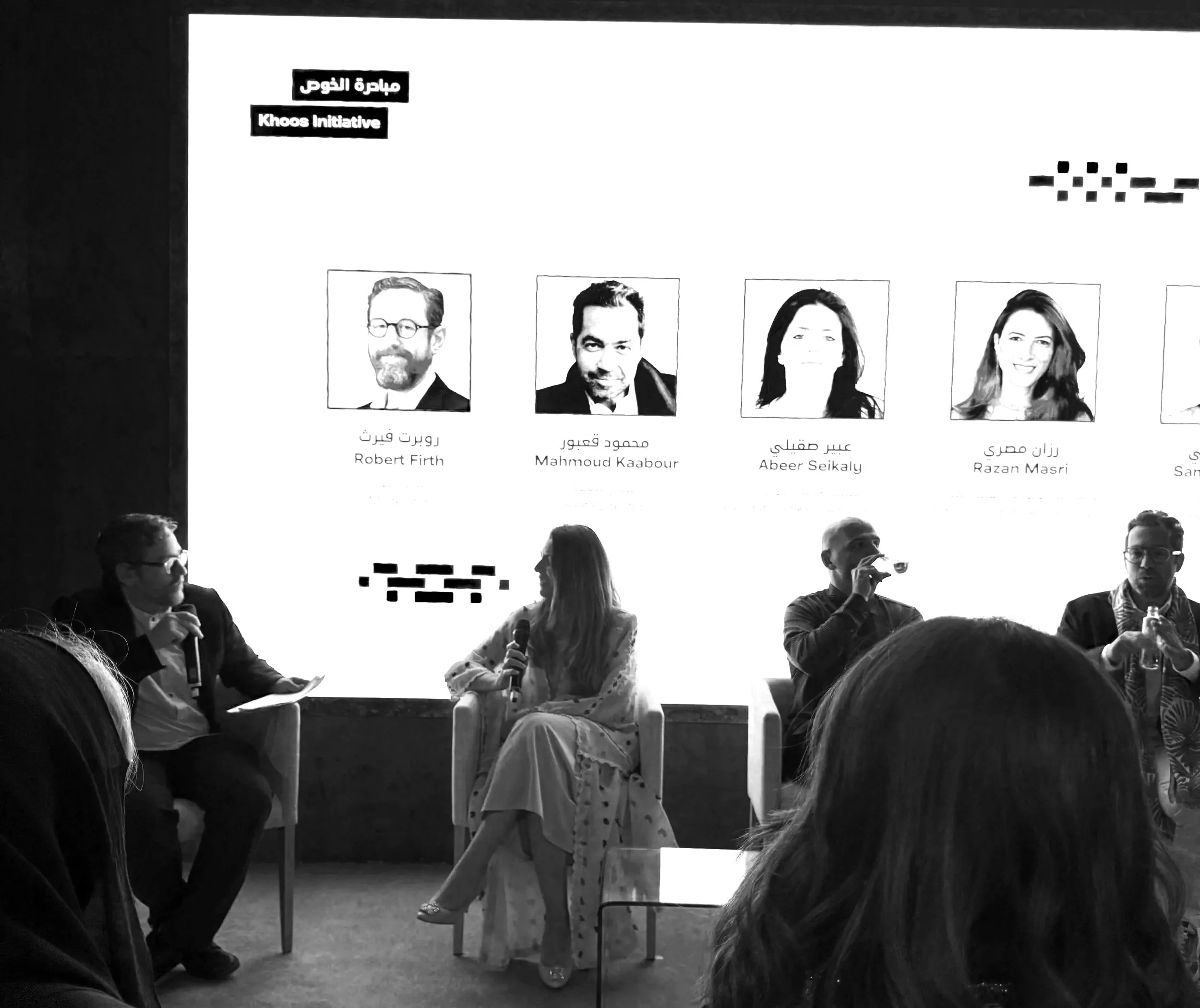 Razan moderating a cultural discussion and research panel