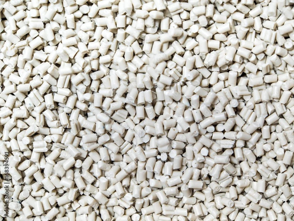Close-up of numerous small white plastic pellets.