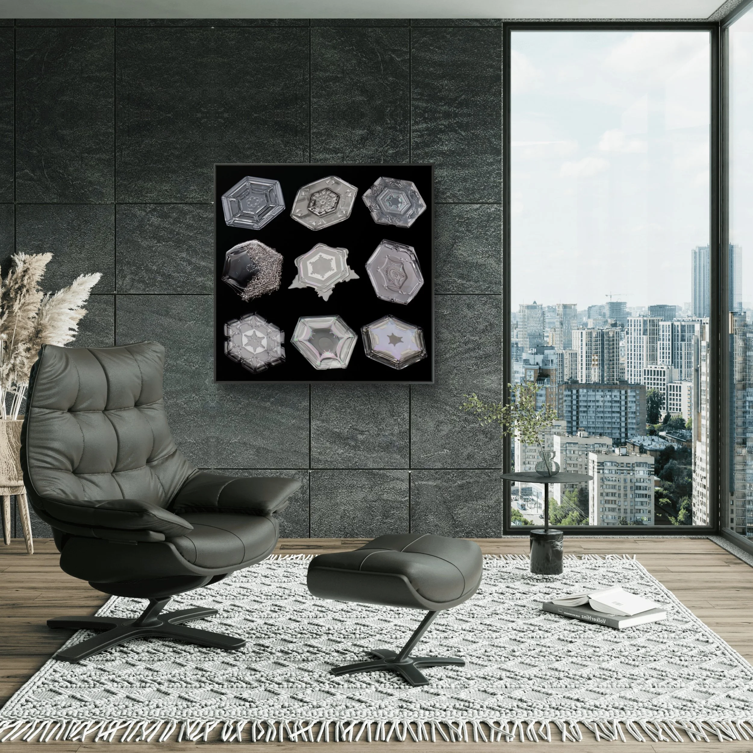Modern living room with black leather chair and ottoman, white textured rug, side table with plant, large window view of city buildings, framed black and white wall art of small plate-shaped snow crystals.