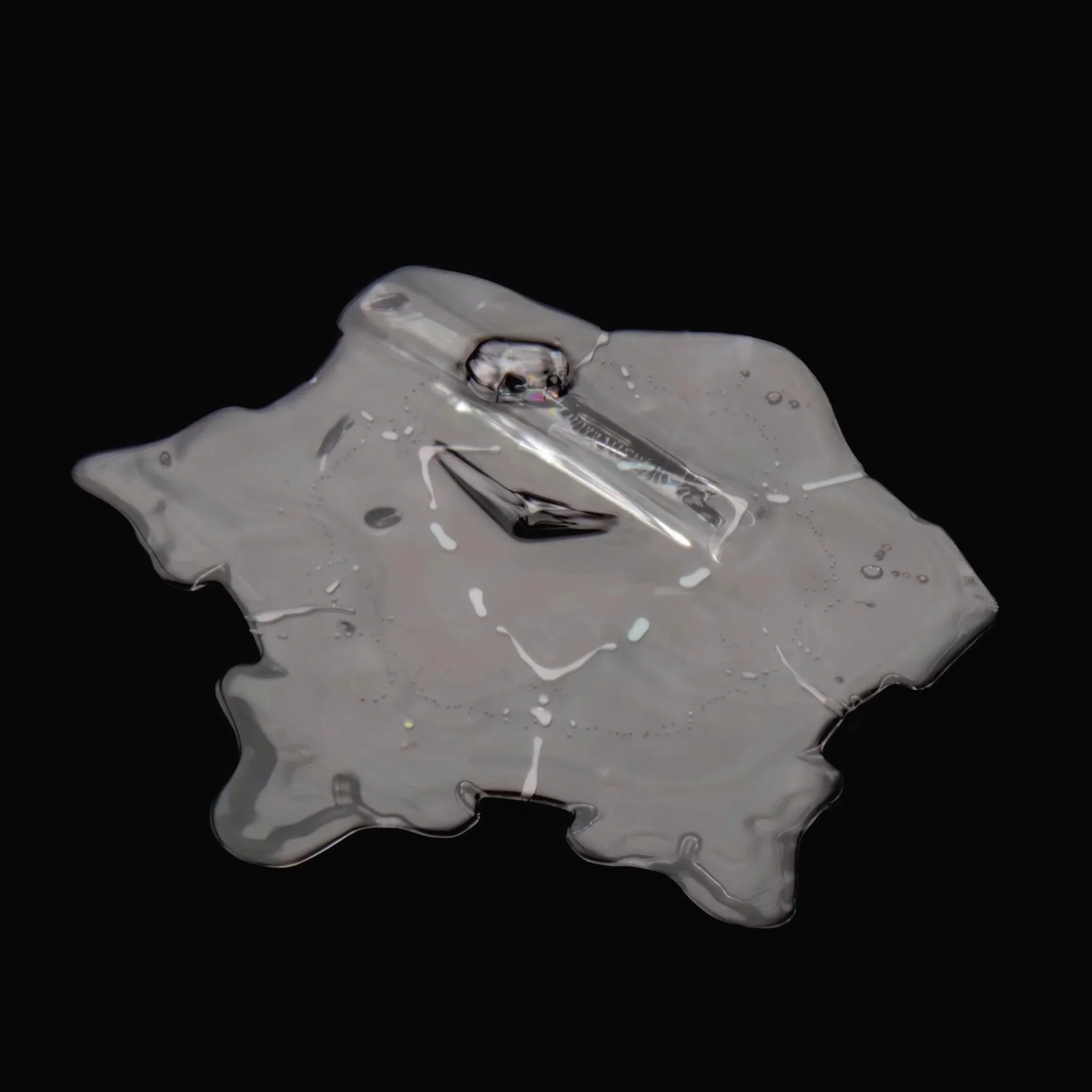 Macro photograph of an irregular shaped snow crystal.