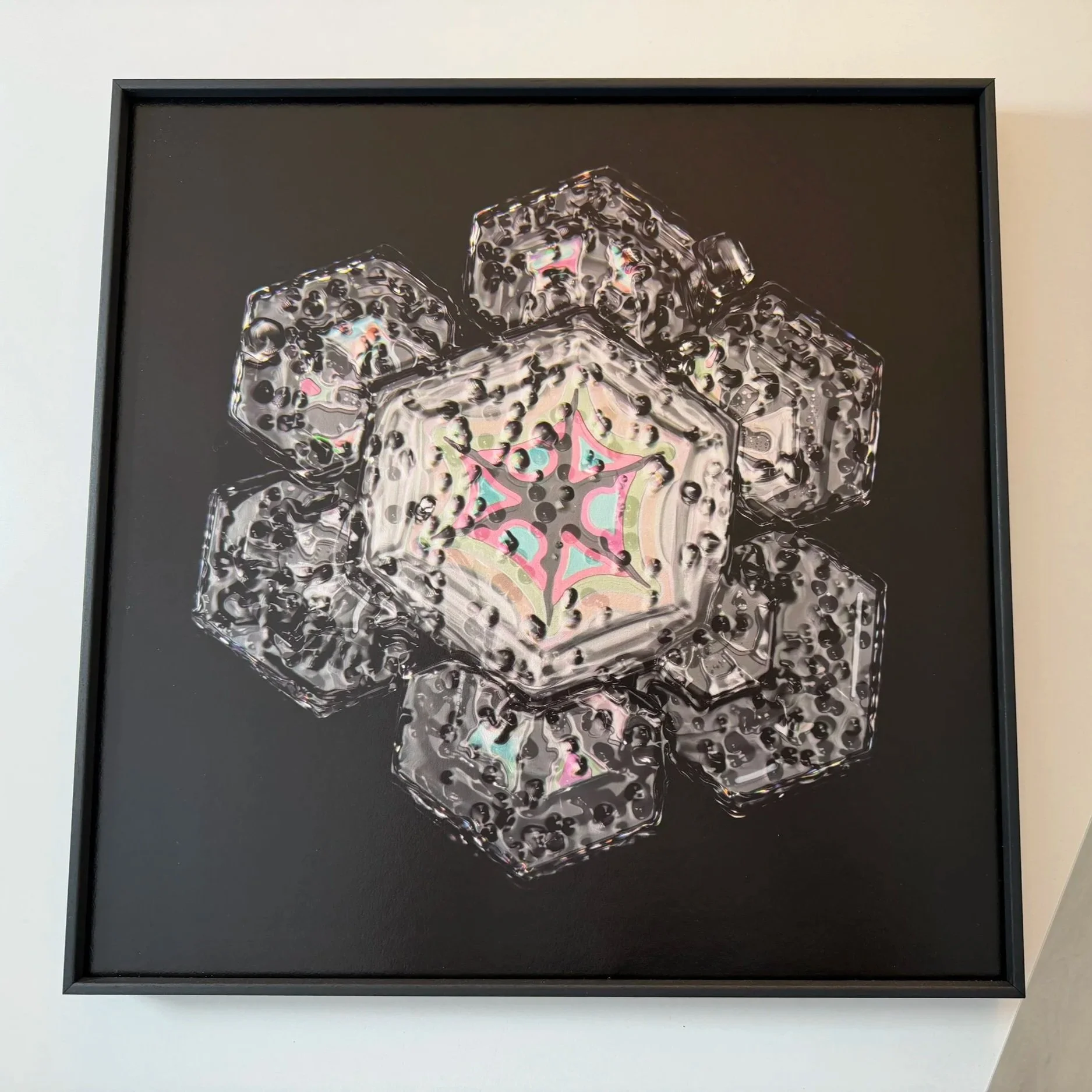 Fine art snowflake photograph with emerging thin‑film colours.