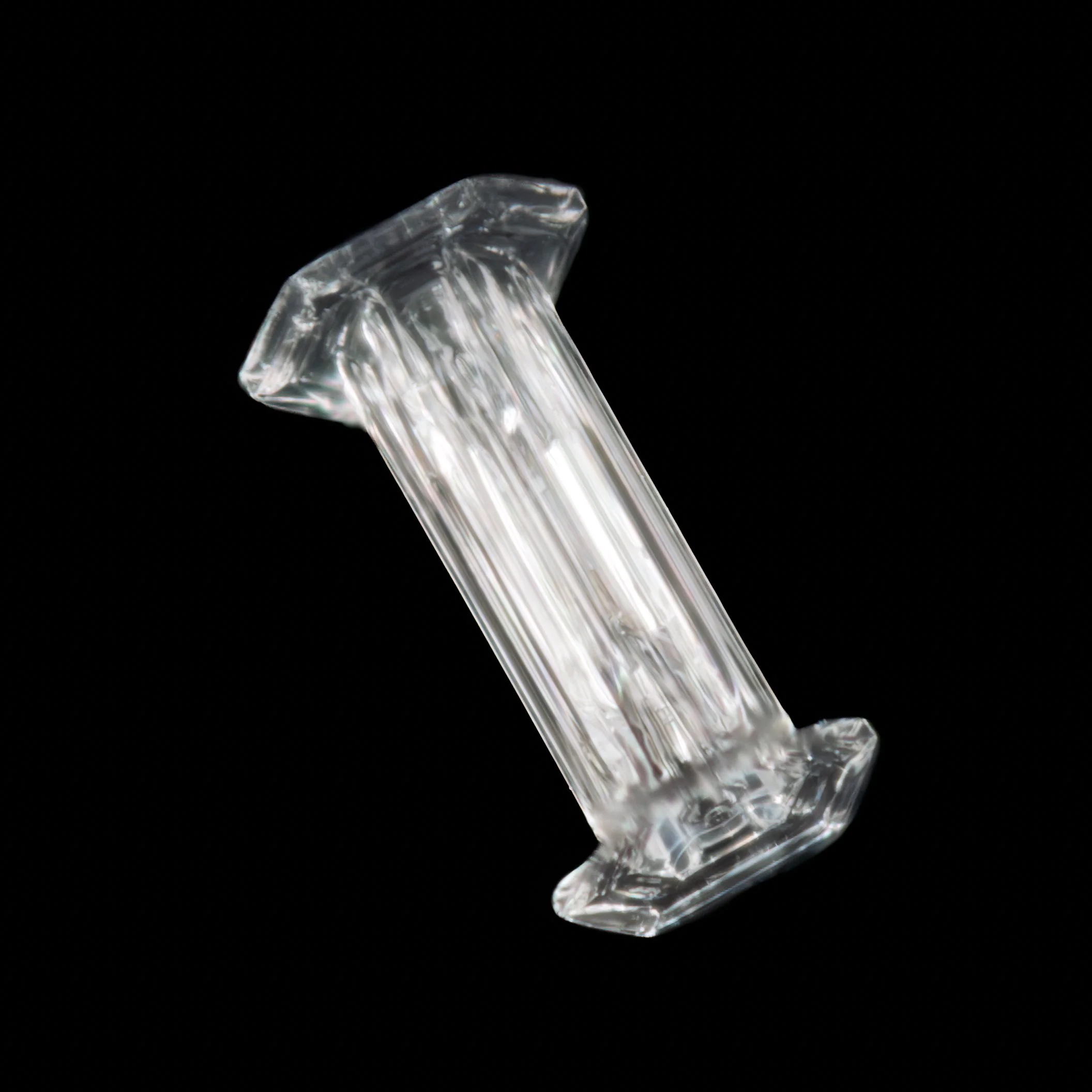 Macro photograph of a hollow column-shaped snow crystal.