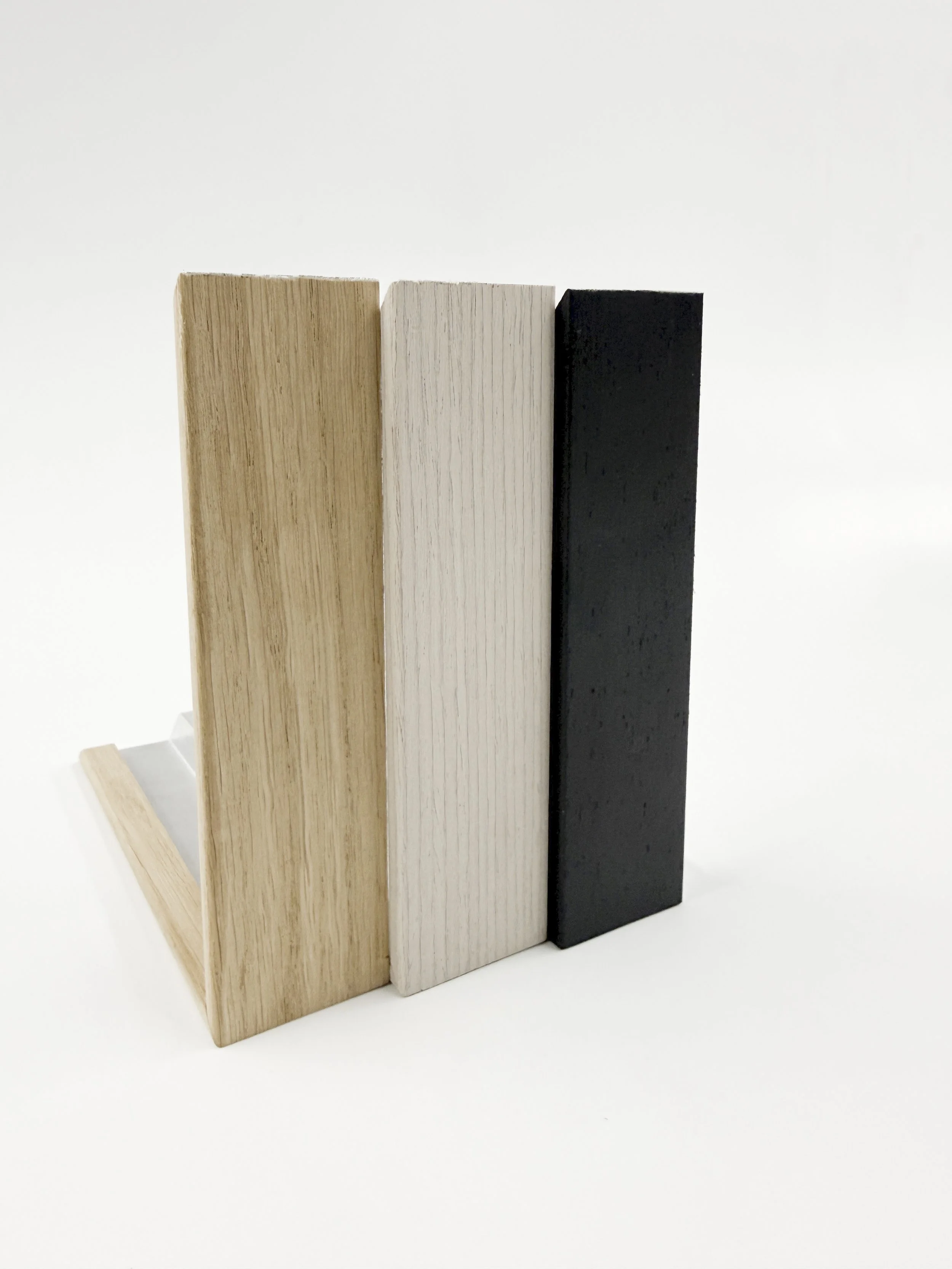 Three aluwood frames featuring oak, anthracite black and white colours.