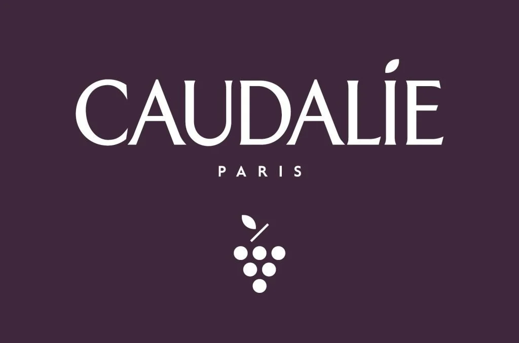 Caudalie Paris logo with grapevine icon on a purple background