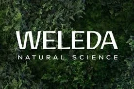 Weleda logo over a background of green foliage