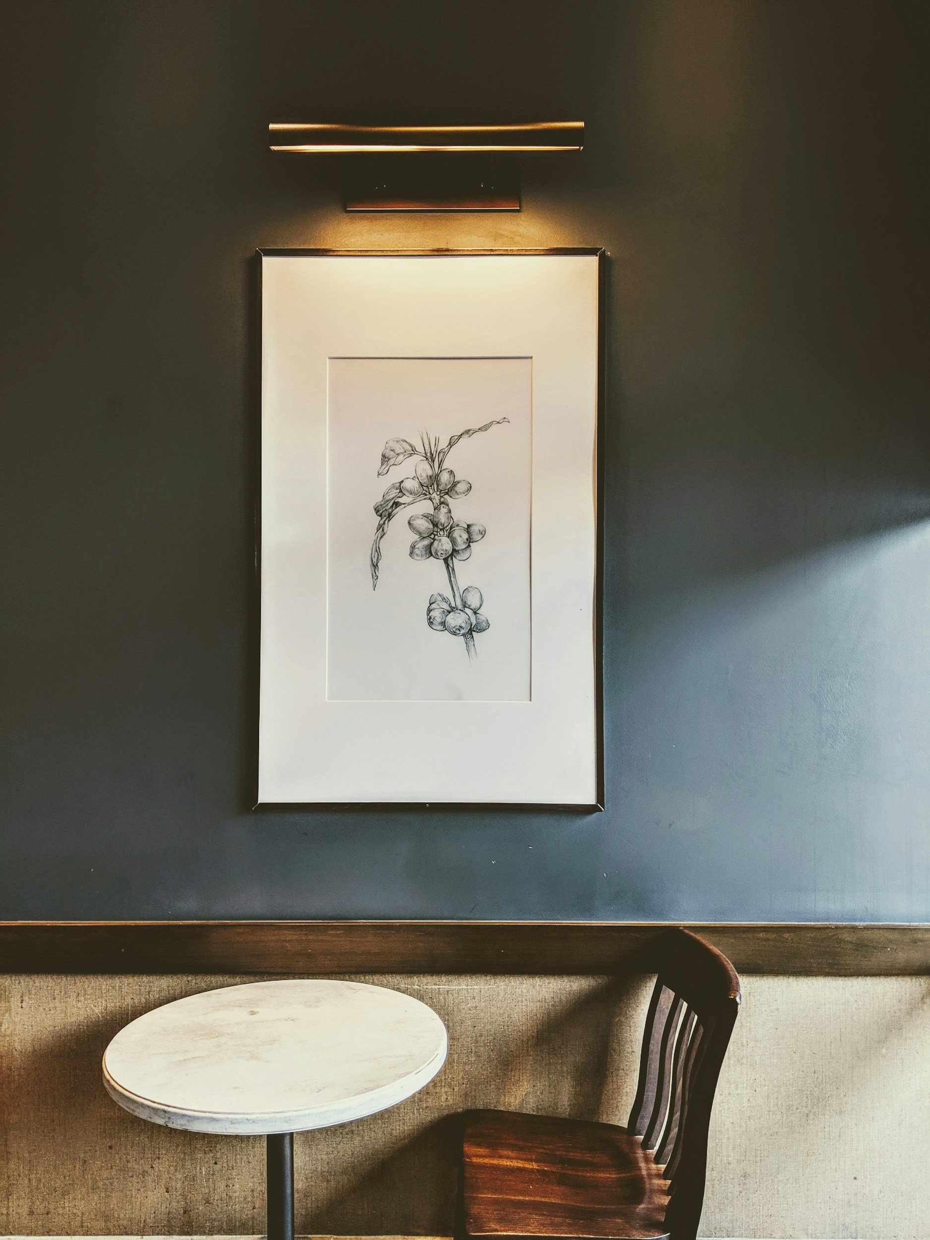 Calm, quiet interior with botanical artwork, evoking a sense of stillness and relief from anxiety