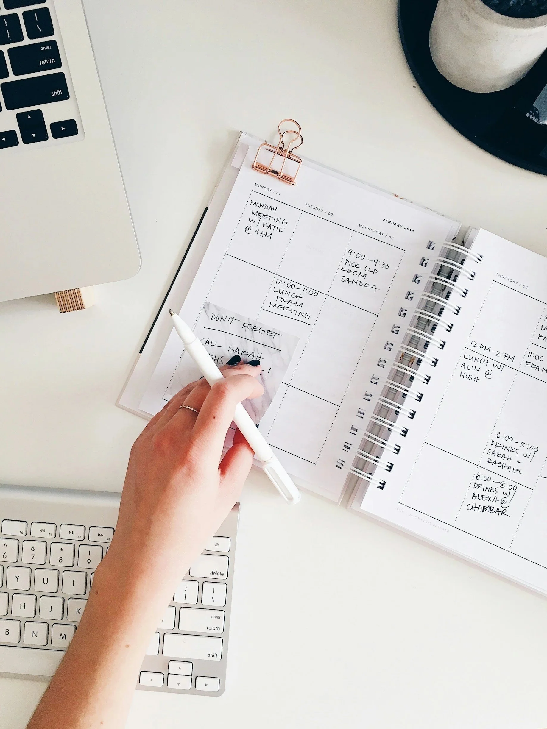 Adult organizing a weekly planner, a common strategy for managing ADHD symptoms