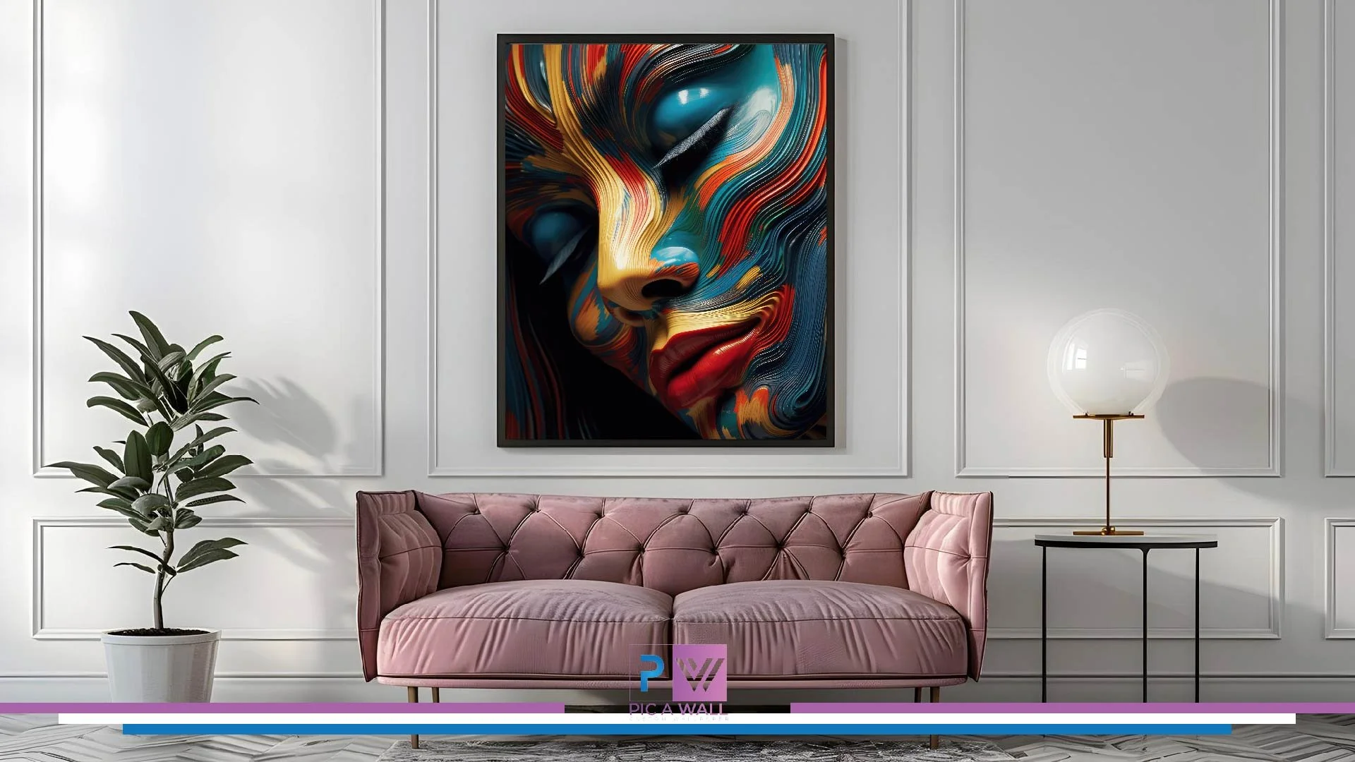 A modern living room with a pink velvet tufted sofa, a white wall panel with molding, a large abstract portrait painting of a woman's face with vibrant swirl colors, a tall green plant in a white pot, a black side table, and a globe-shaped table lamp