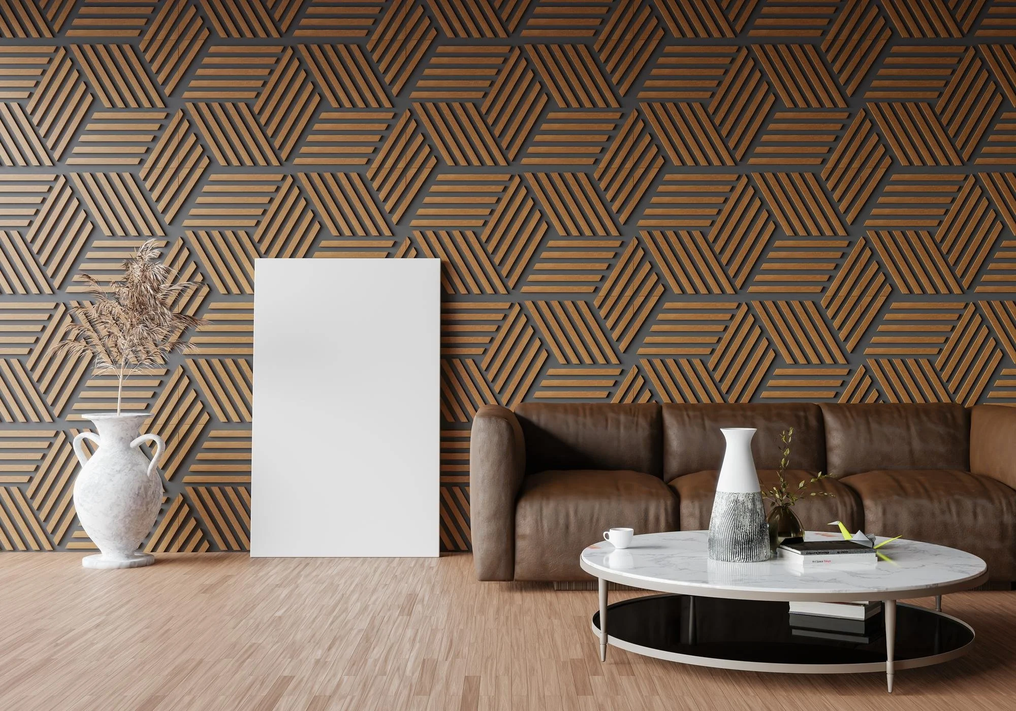Living room with a geometric patterned wallpaper, a brown leather sofa, a white oval coffee table with a black bottom shelf, decorative vases, a potted plant, a white photo frame, and a large white decorative pitcher with dried plants.