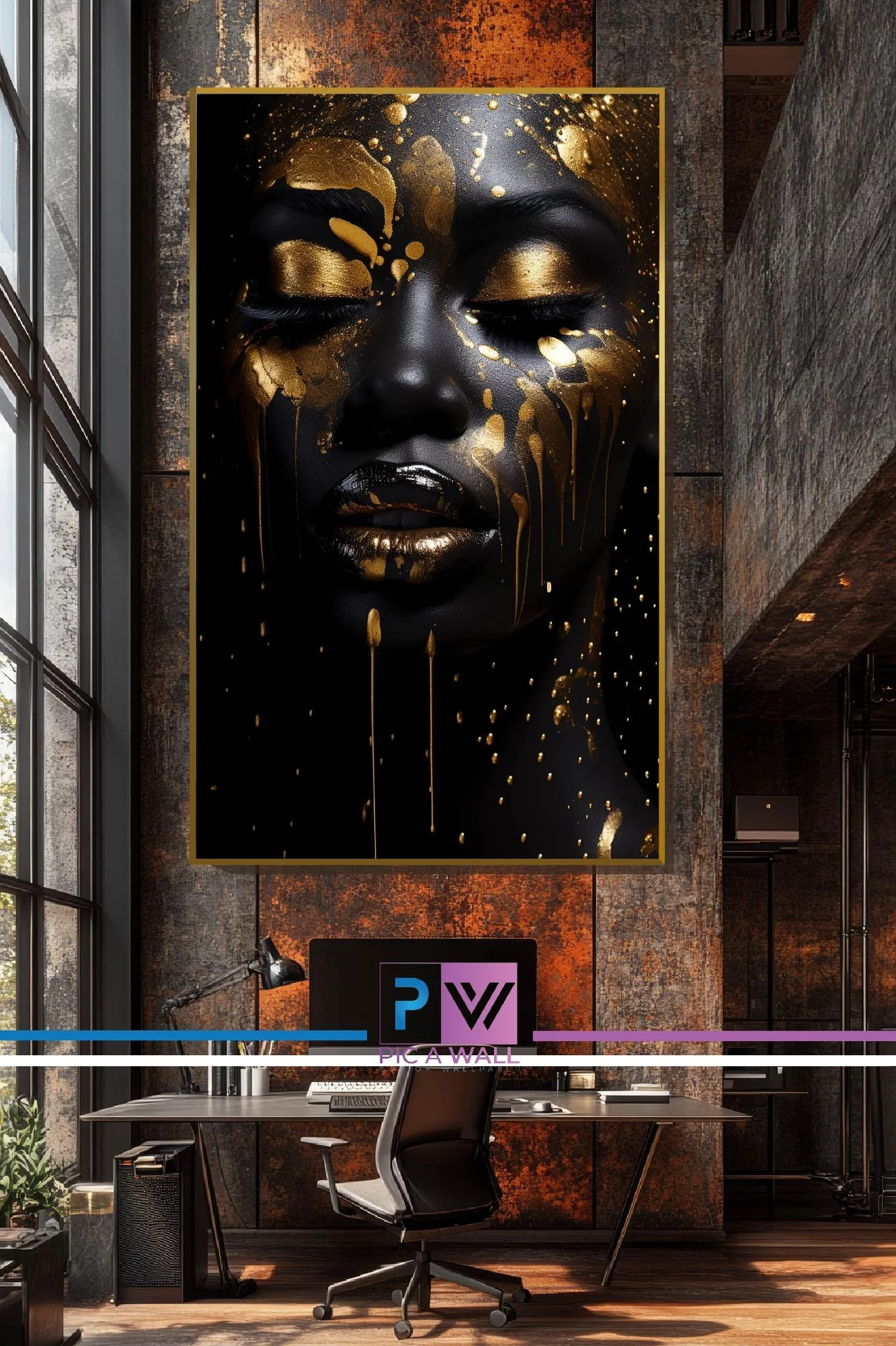 Modern workspace with a displayed large artwork of a woman's face with gold and black paint, a desk with a computer monitor, and a chair.