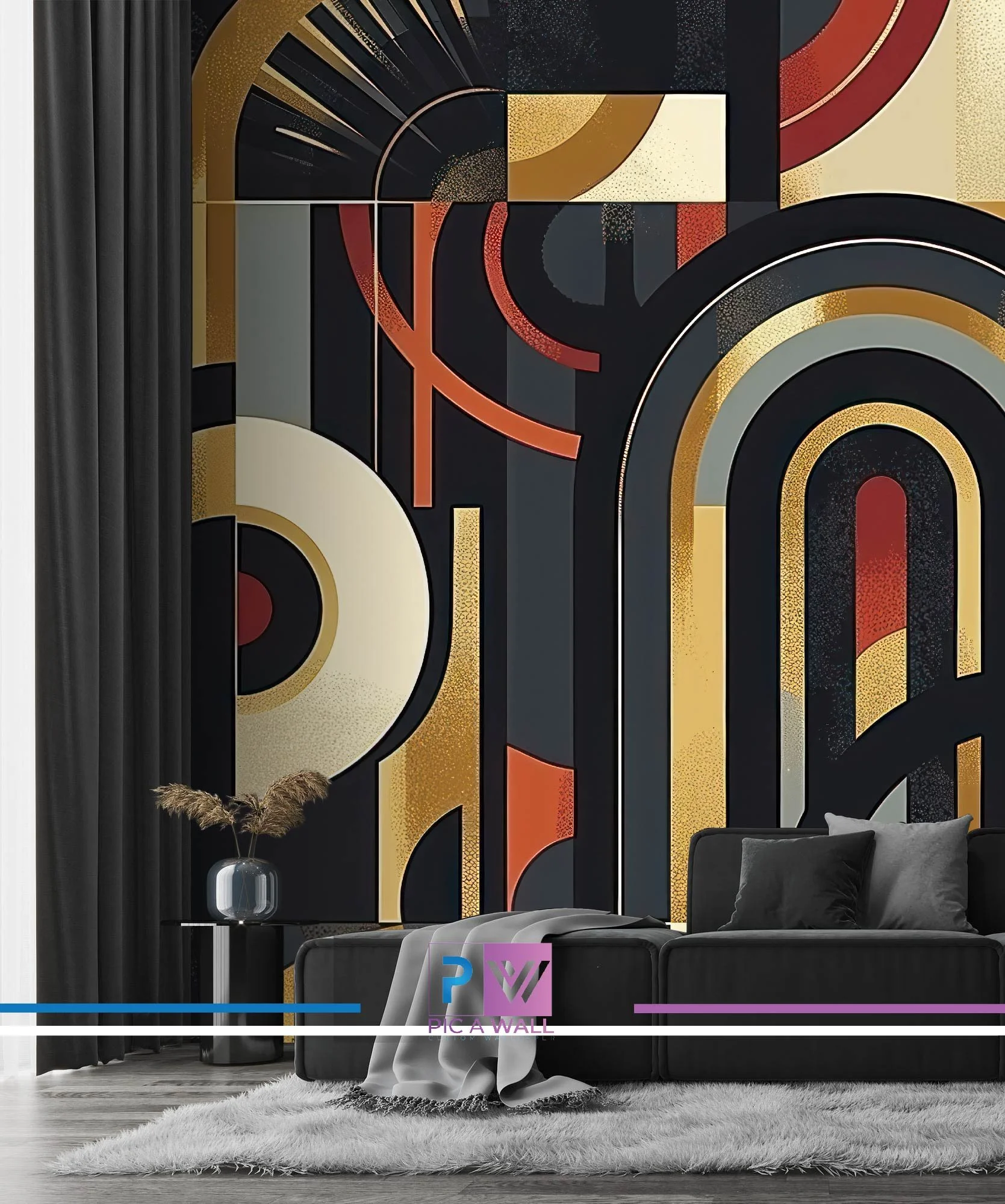 Modern living room with a geometric mural featuring black, gold, cream, red, and gray shapes on the wall behind a black couch with black pillows. A small side table with a gray vase holding brown pampas grass is next to the couch, and a white fluffy rug is on the floor.