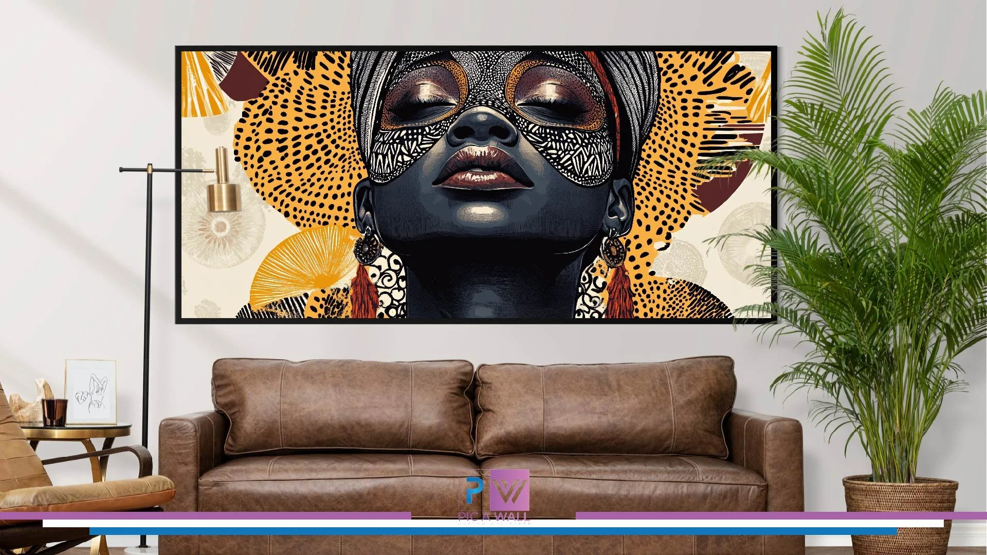 Colorful artwork of a woman with a headwrap and ornate face mask hanging above a brown leather couch in a modern living room with a tall green plant.