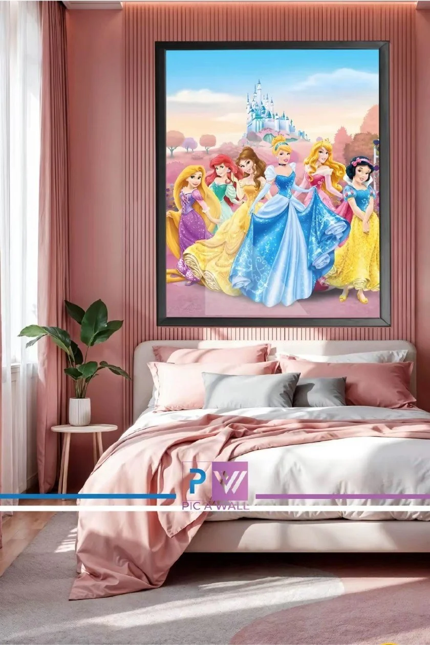 A bedroom with pink walls, a bed with pink and white bedding, and a large framed Disney princess poster featuring princesses Aurora, Ariel, Belle, Cinderella, Rapunzel, and Snow White, with a castle in the background.
