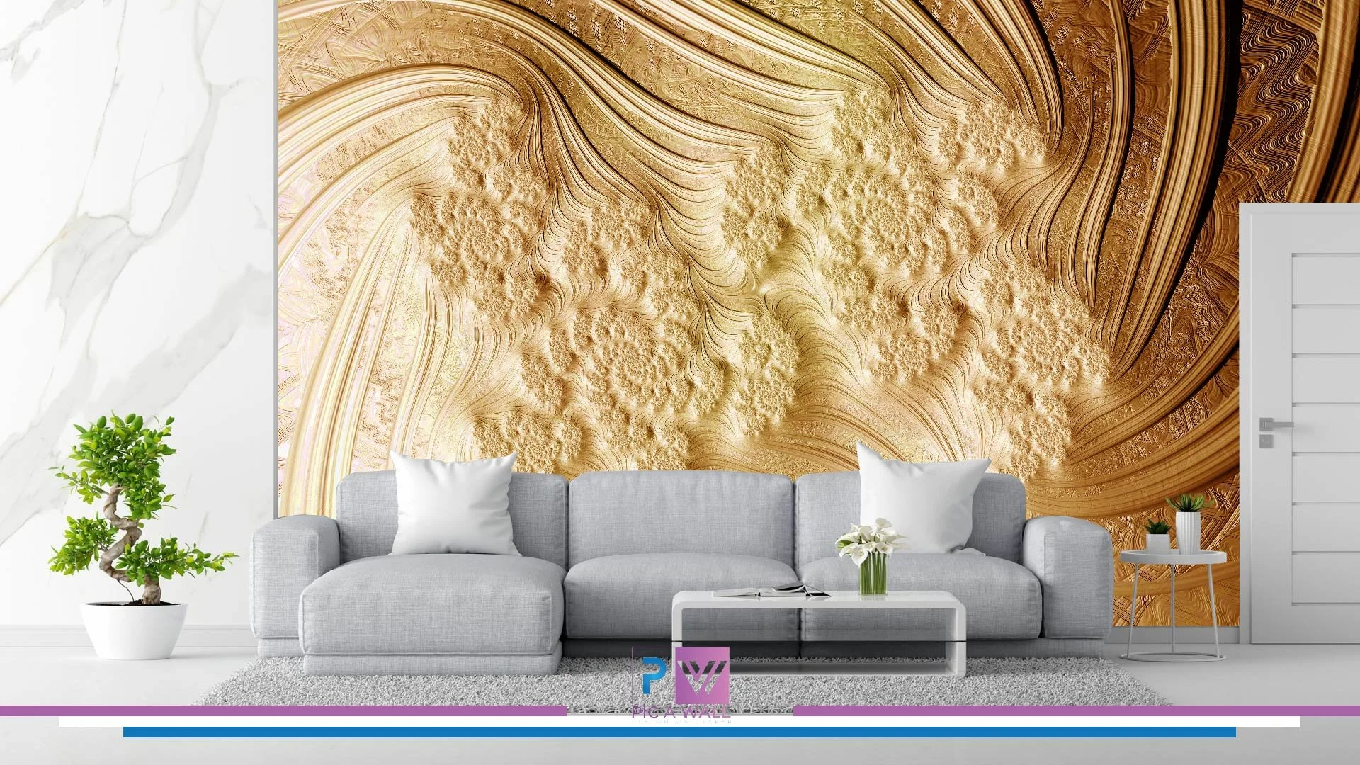 Living room with a modern gray sofa, white cushions, and a coffee table with white flowers. A potted plant is on the left, and a small white side table with potted plants on the right. The wall behind has an abstract, textured gold and brown mural.