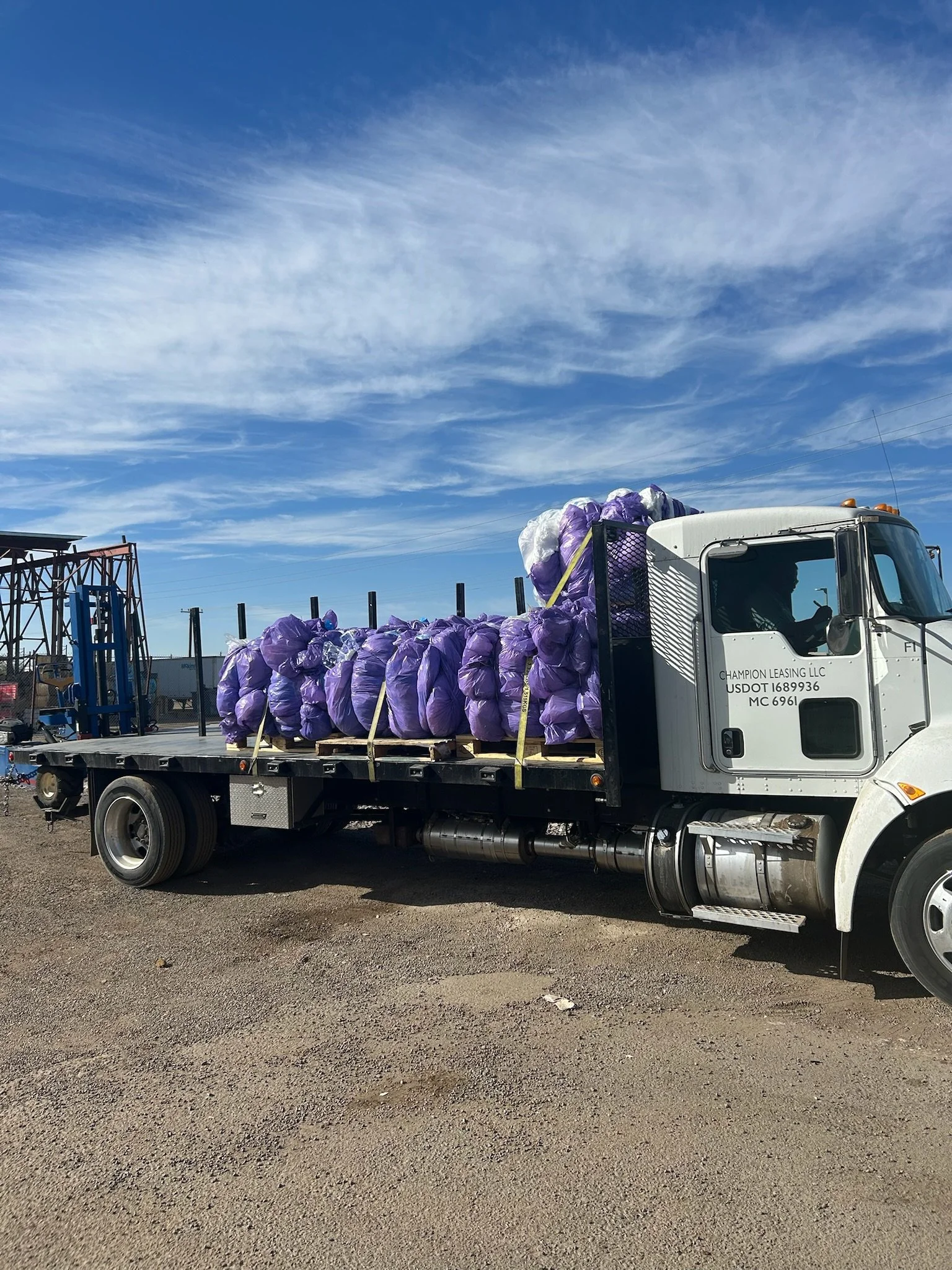 commercial recycling pickup truck hauling baled plastic materials in Phoenix Arizona