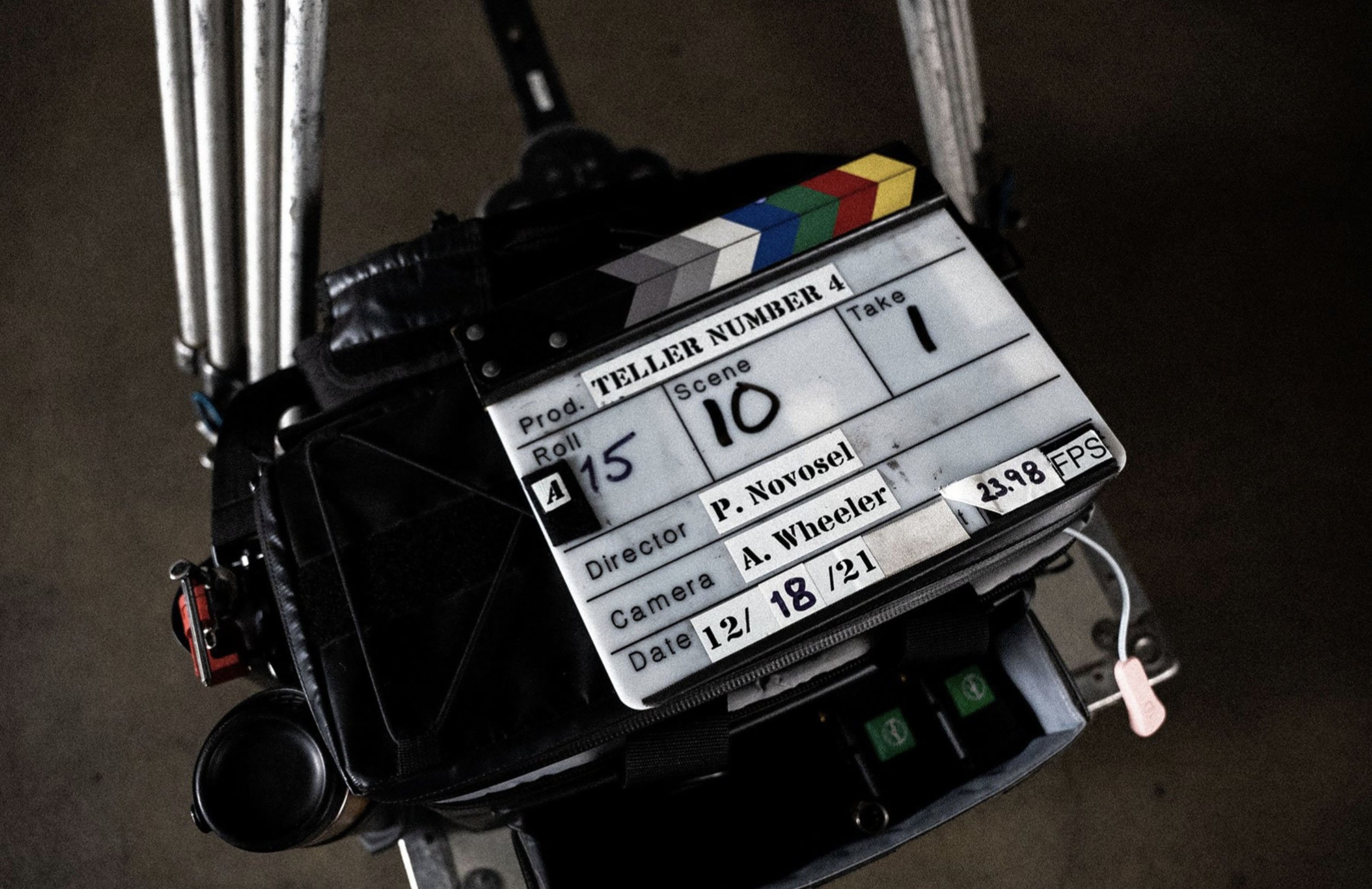 Clapperboard with production details for a film scene, marked with scene 10, take 1, directed by P. Novosel, and shot by A. Wheeler, on December 18, with a camera speed of 2398 FPS.