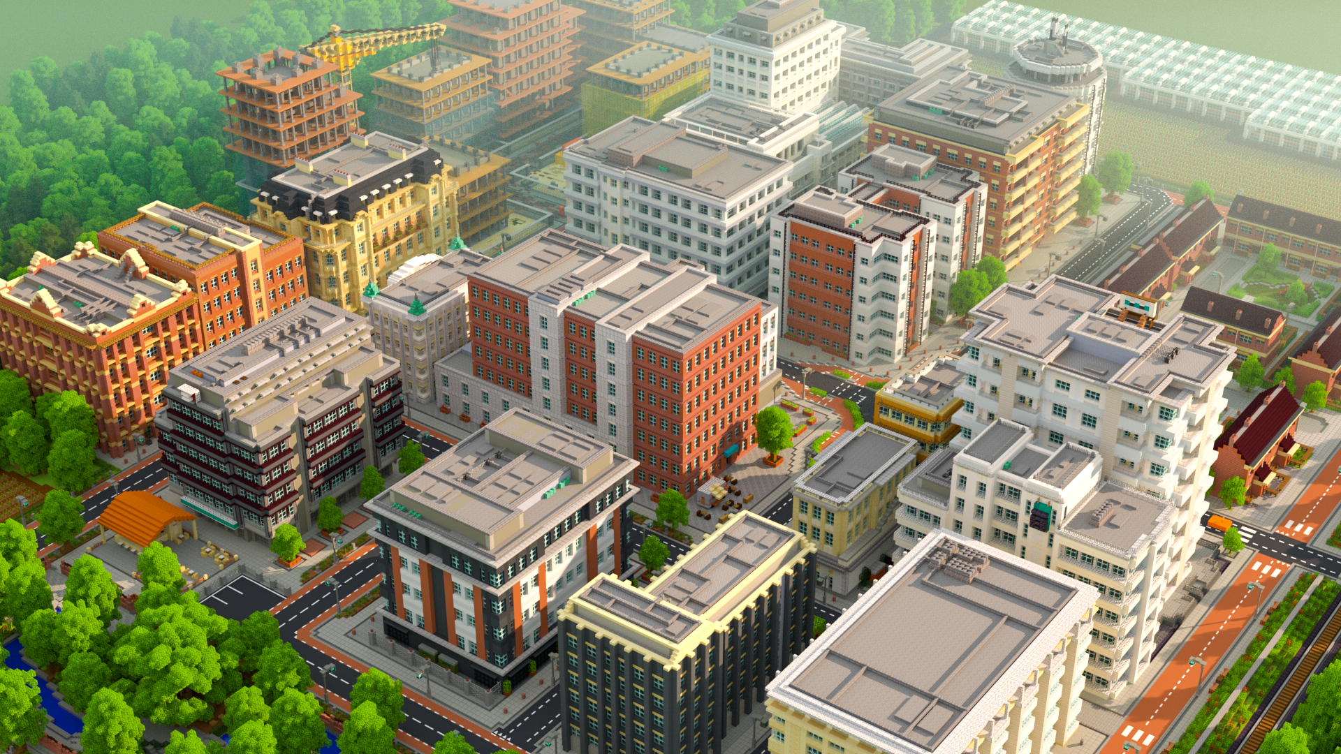 An aerial view of a city with various modern buildings, trees, roads, and a construction site in the background.