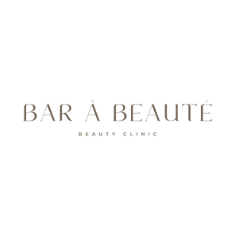 Logo for Bar A Beauté, a beauty salon, on a black background with gold lettering.