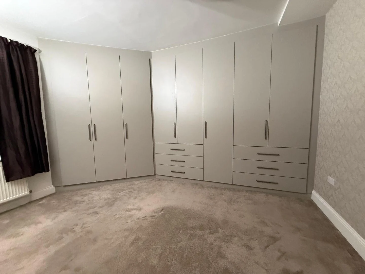 Project Complete 🍏

Another full bedroom transformation finished. This install wraps the entire corner of the room with a complete made to measure wardrobe run, built to fit perfectly from wall to wall. Every cabinet, rail and drawer pack was design